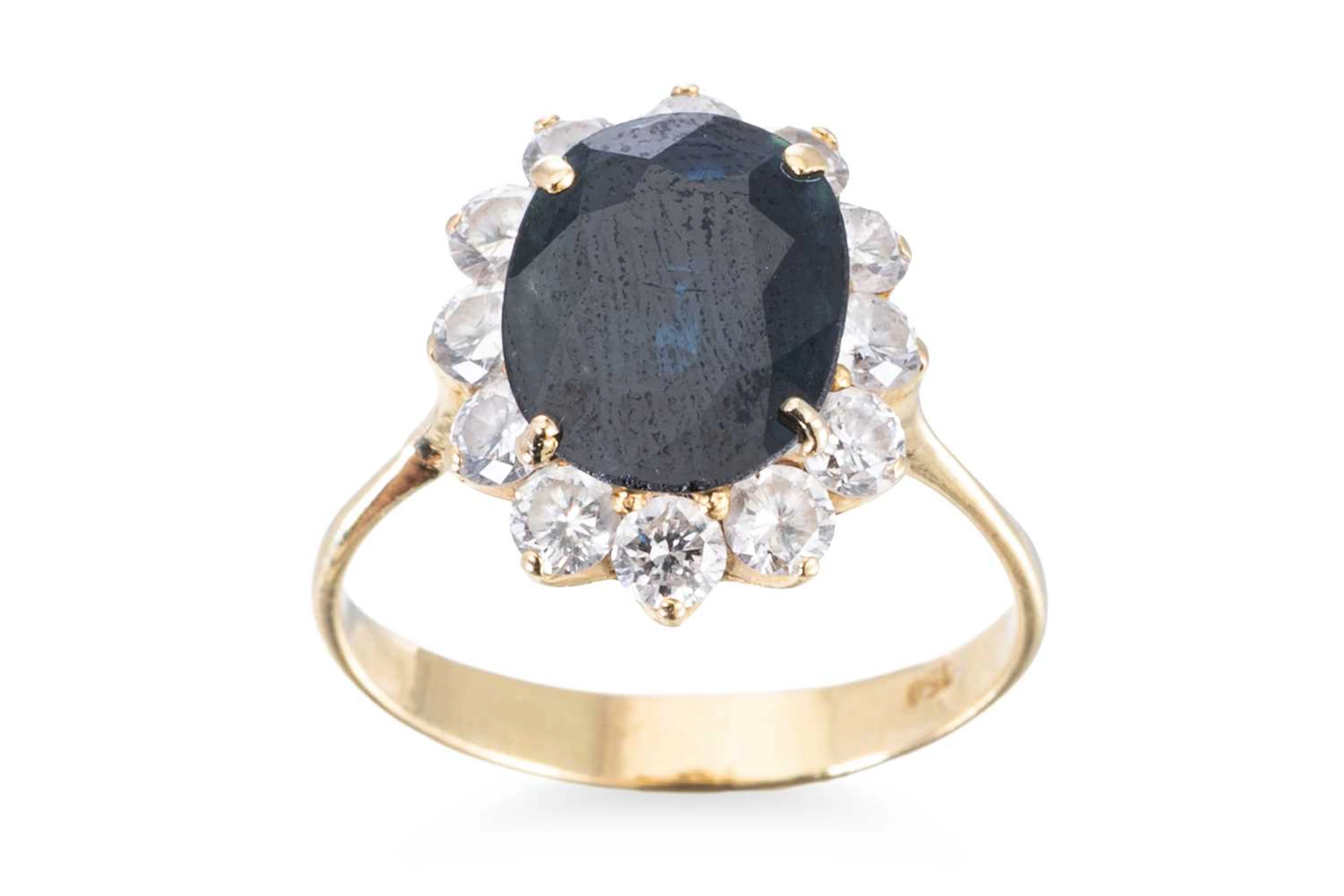 A SAPPHIRE AND DIAMOND CLUSTER RING