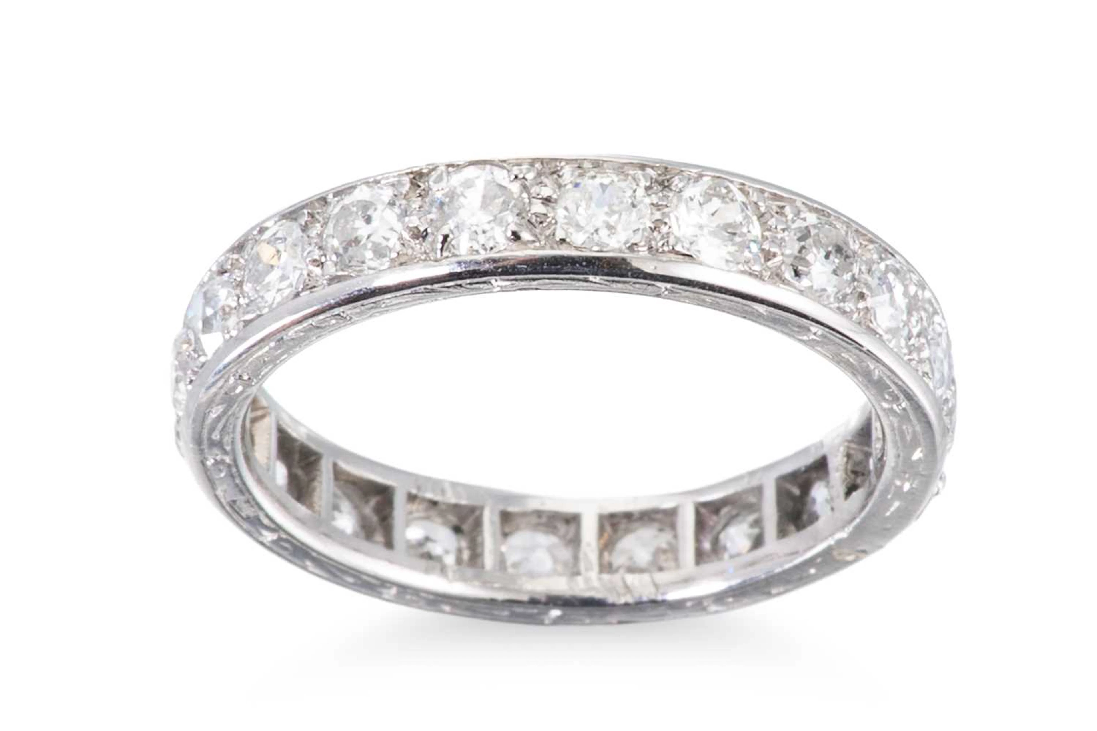 AN EARLY 20TH CENTURY FULL BANDED DIAMOND ETERNITY RING