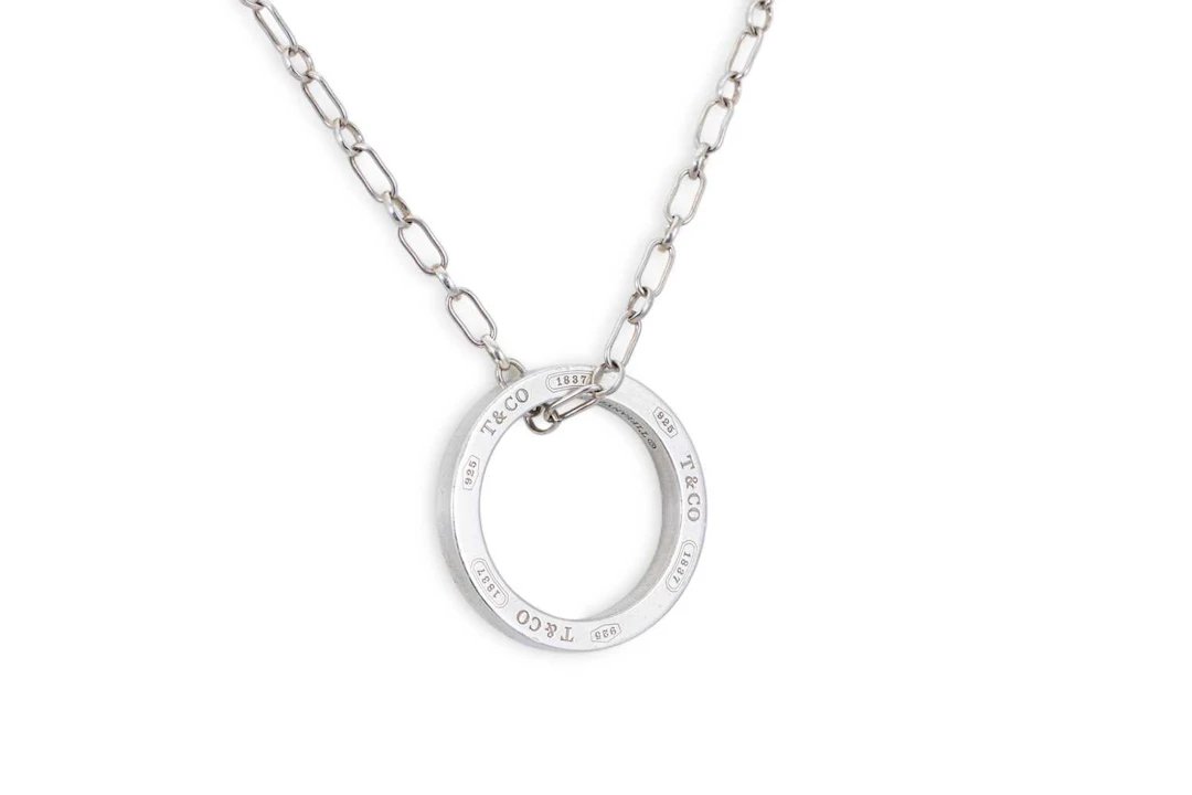 A TIFFANY STERLING SILVER CIRCULAR PENDANT