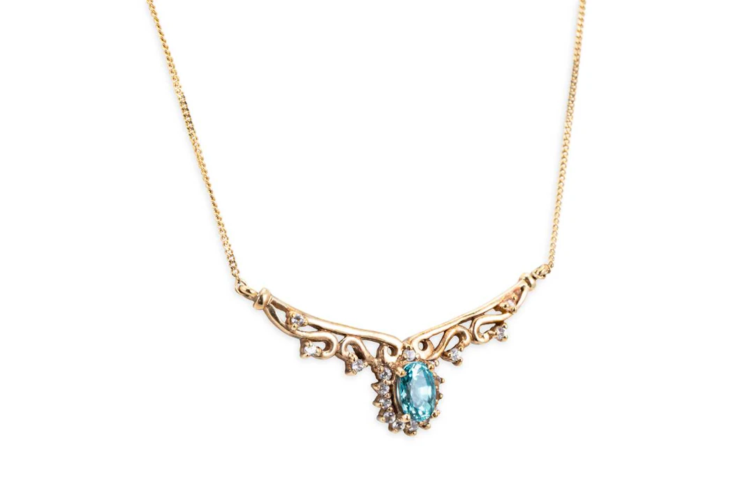 A DIAMOND AND TOPAZ PENDANT