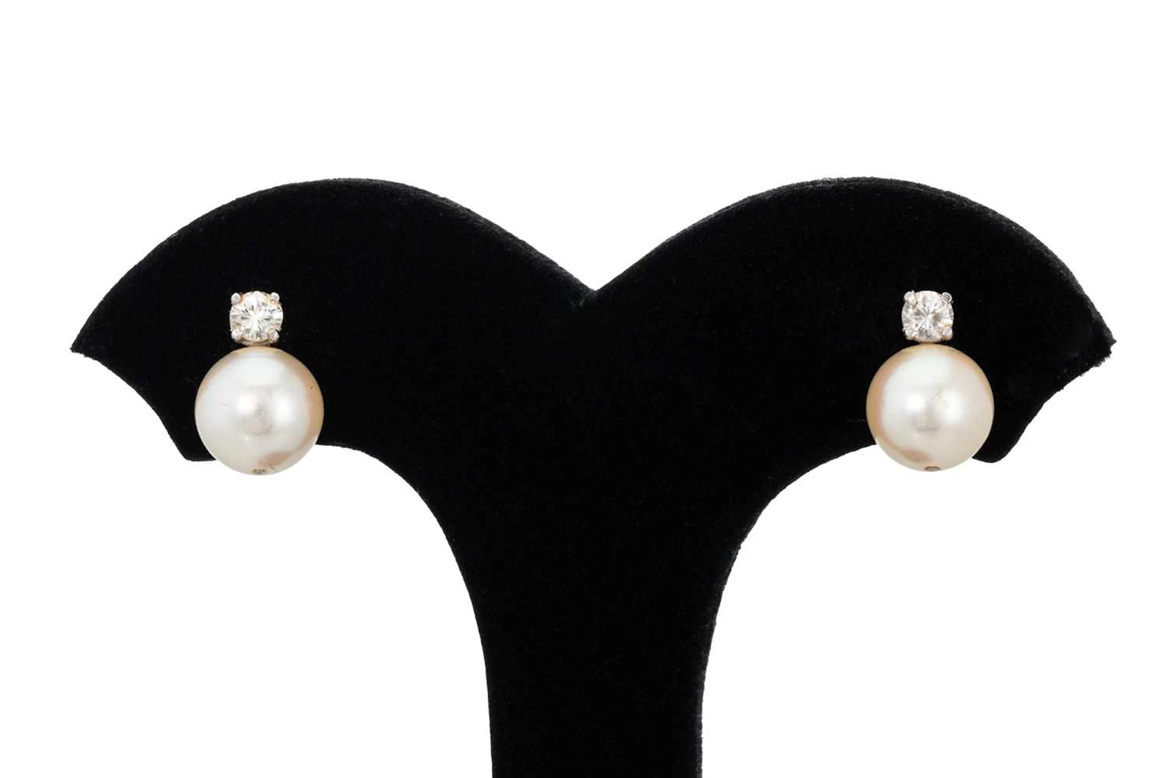 A PAIR OF PEARL AND DIAMOND EARRINGS
