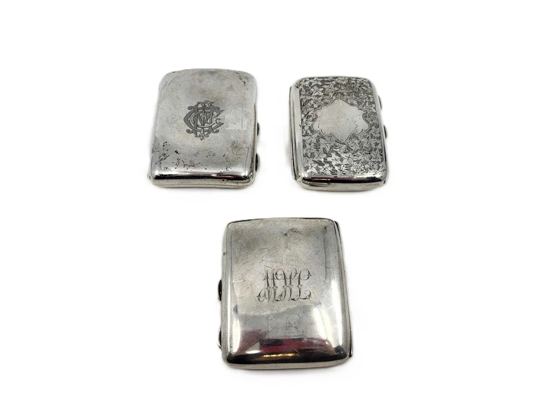 THREE ANTIQUE / VINTAGE SILVER CIGARETTE CASES