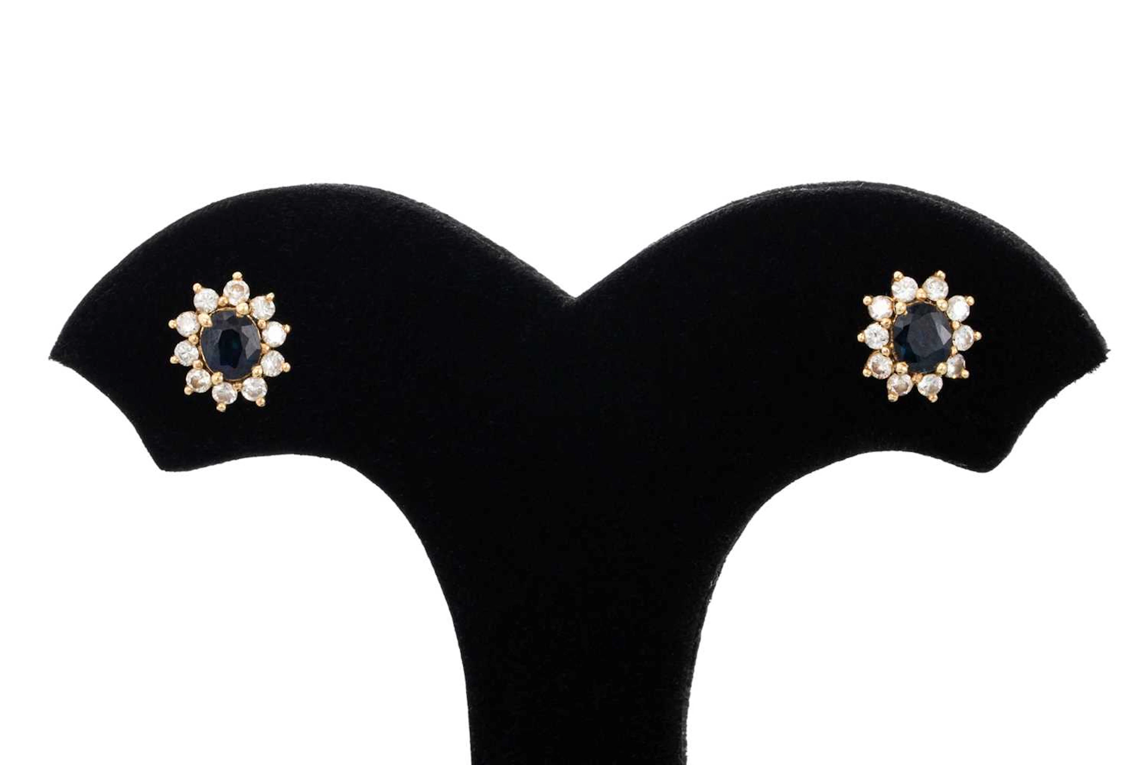 A PAIR OF SAPPHIRE AND DIAMOND CLUSTER EARRINGS