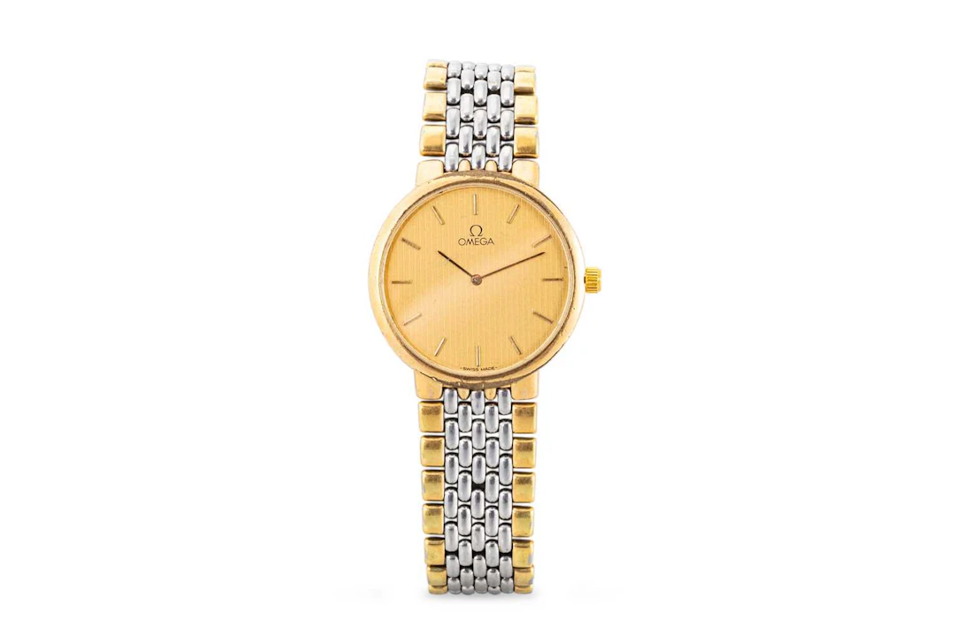 A BI-METAL OMEGA WRIST WATCH