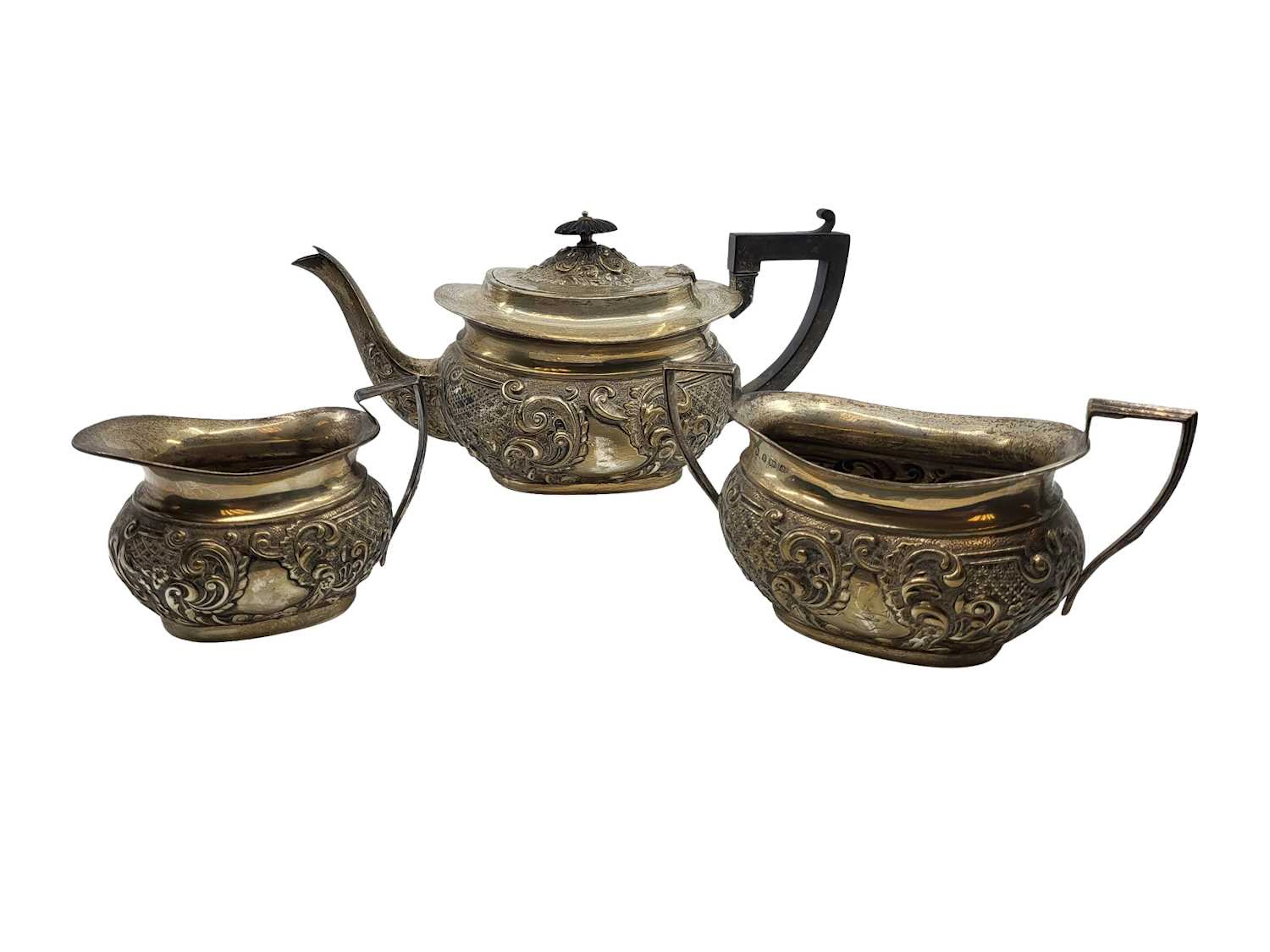 AN ANTIQUE THREE PIECE EDWARDIAN STERLING SILVER (.925) EMBOSSED TEA SERVICE