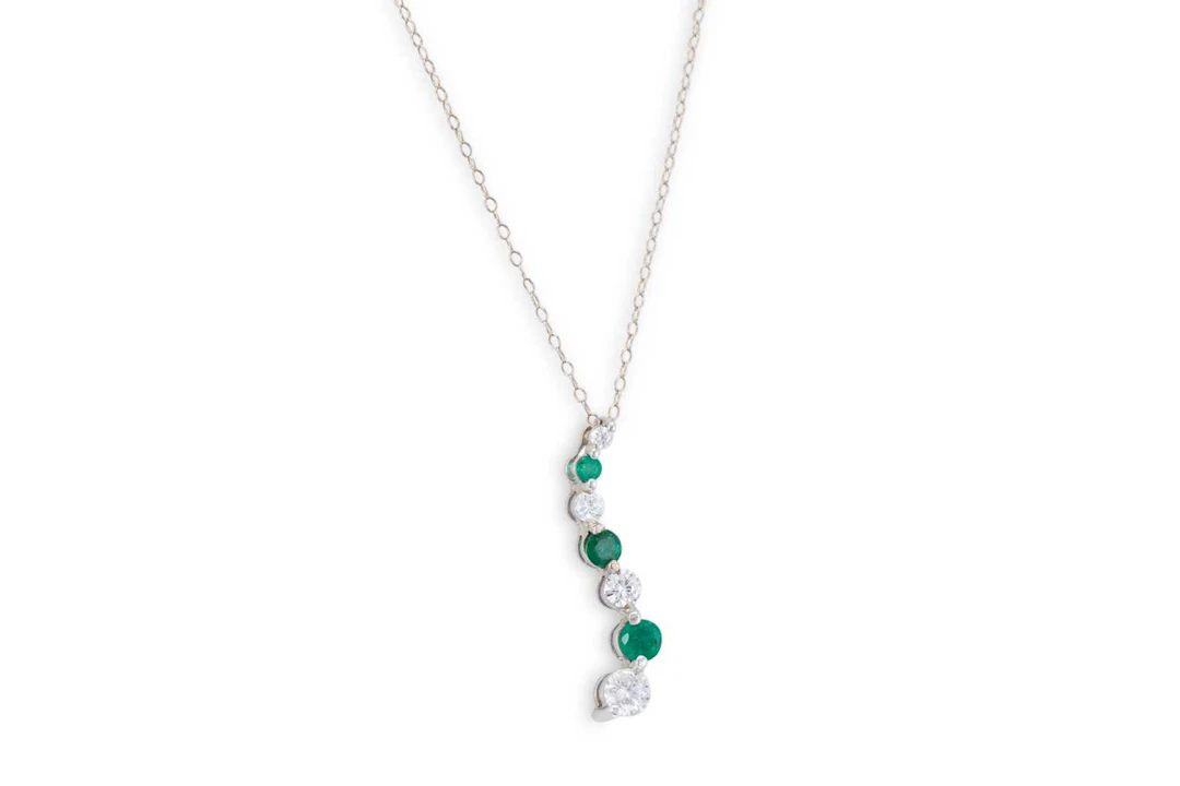 AN EMERALD AND DIAMOND PENDANT
