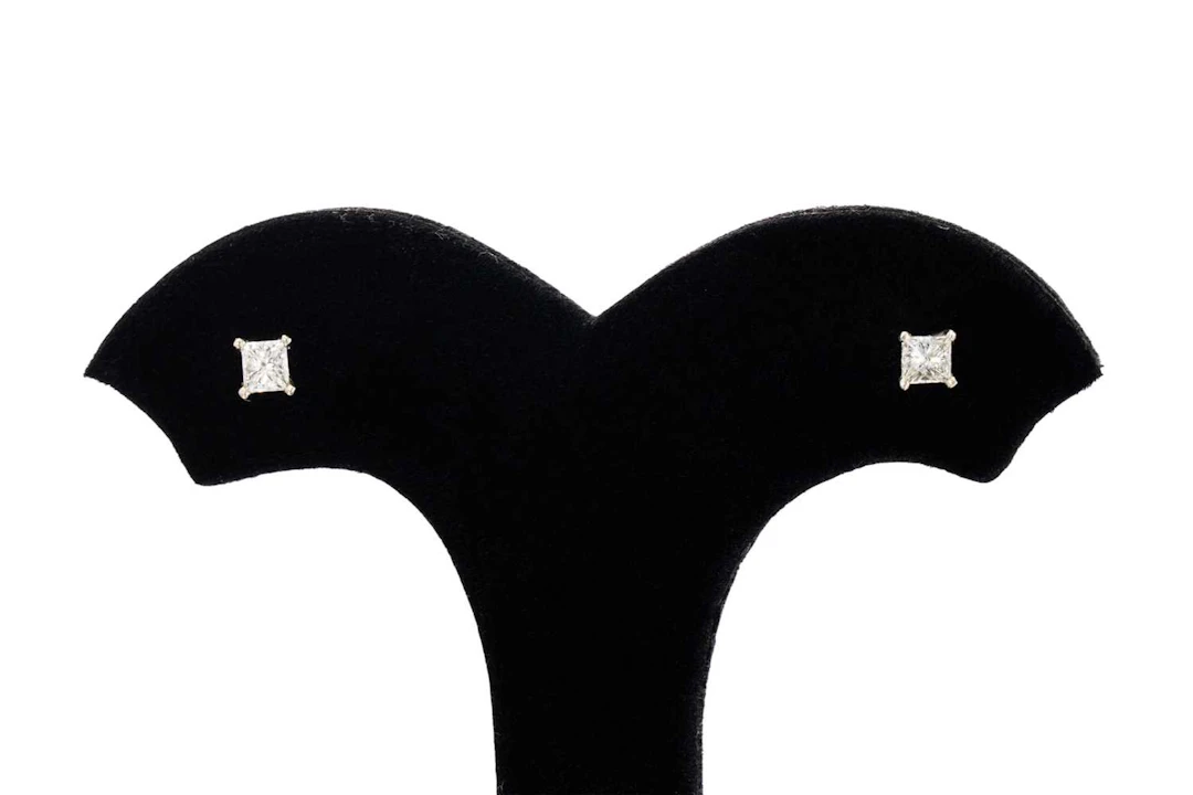 A PAIR OF PRINCESS CUT DIAMOND EARRINGS