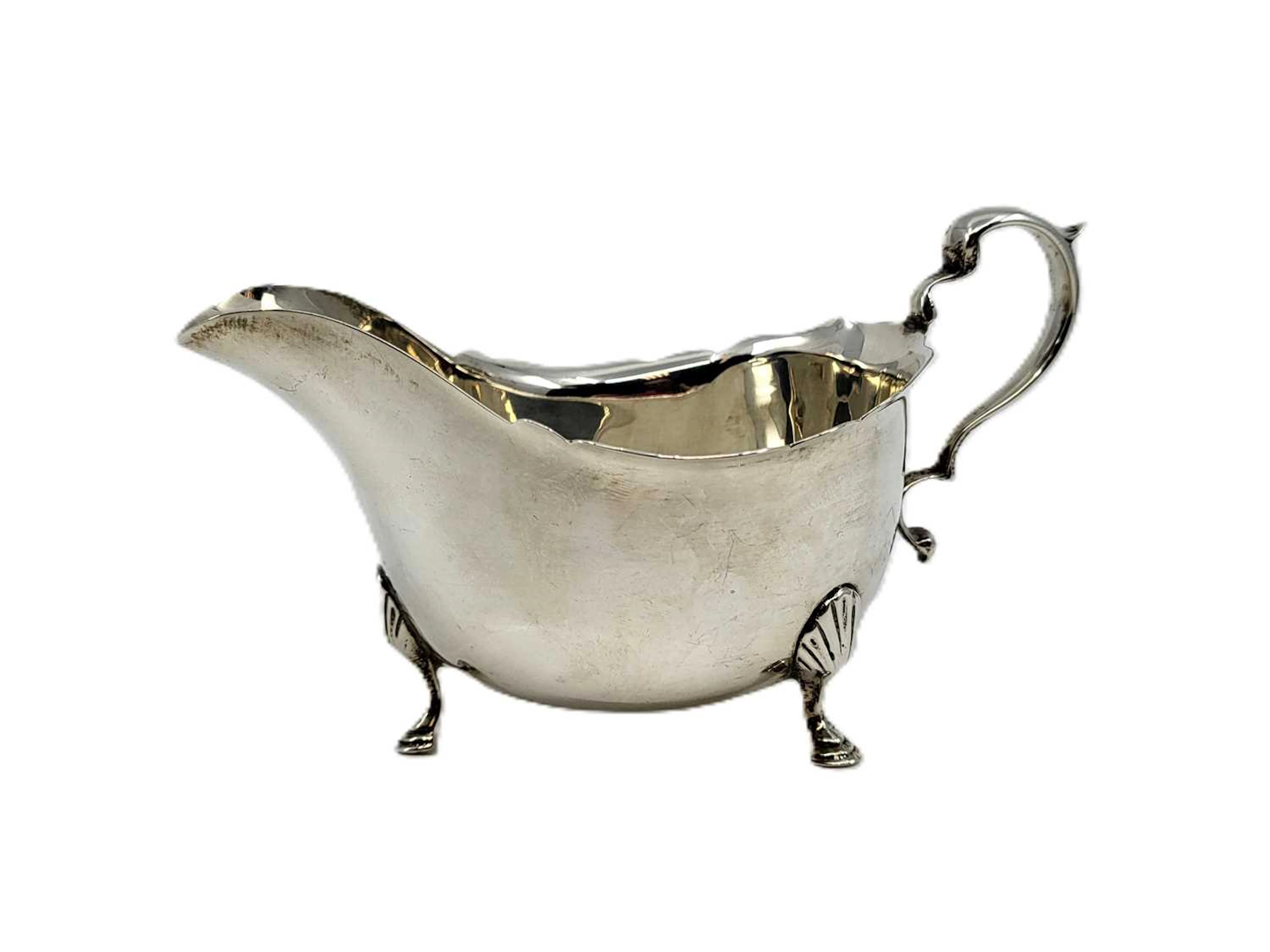 A PRE-WAR STERLING SILVER HELMET-SHAPED SAUCE BOAT