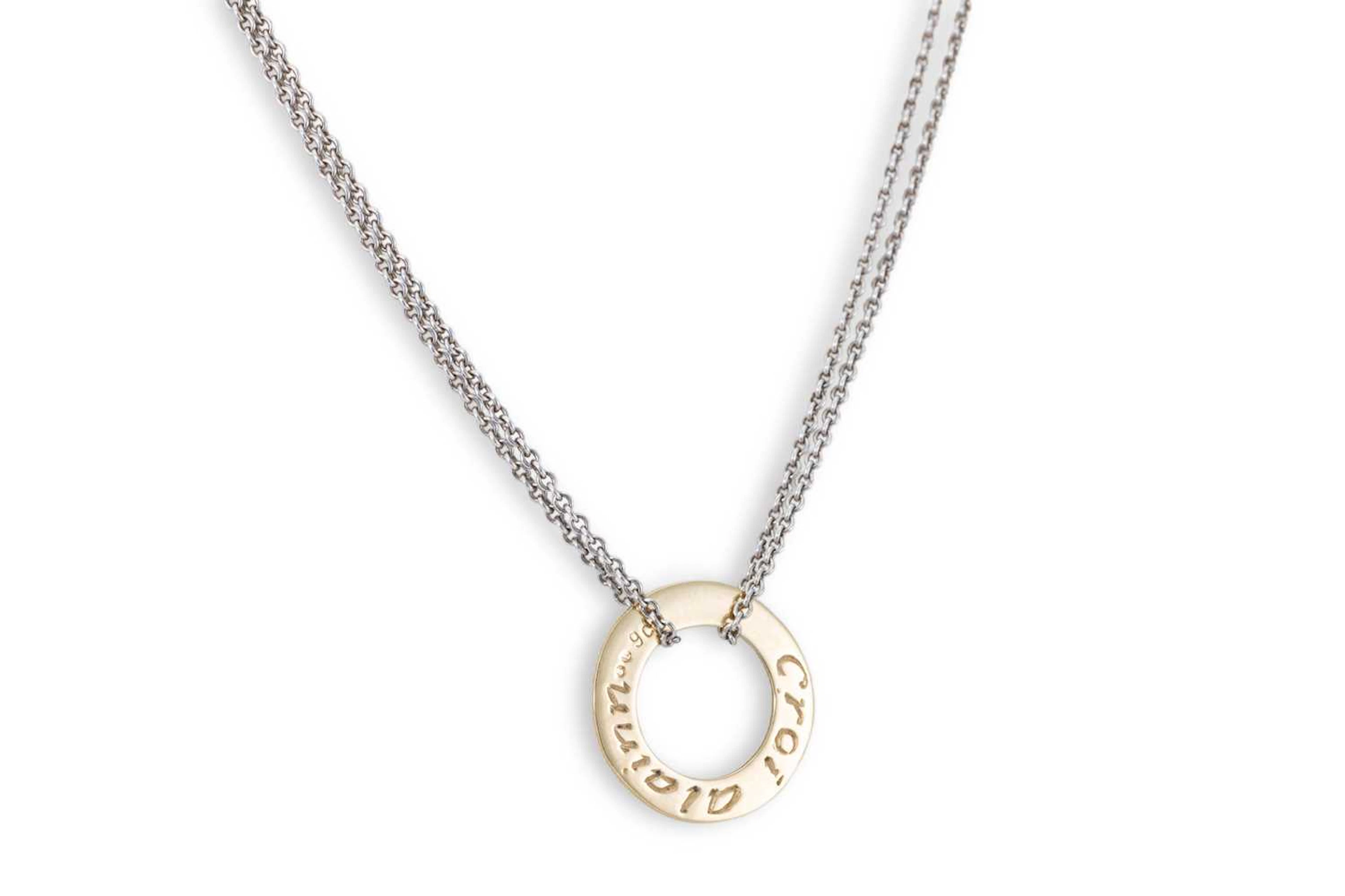 A PENDANT BY 'SANIBA' with a 9ct gold circular disk