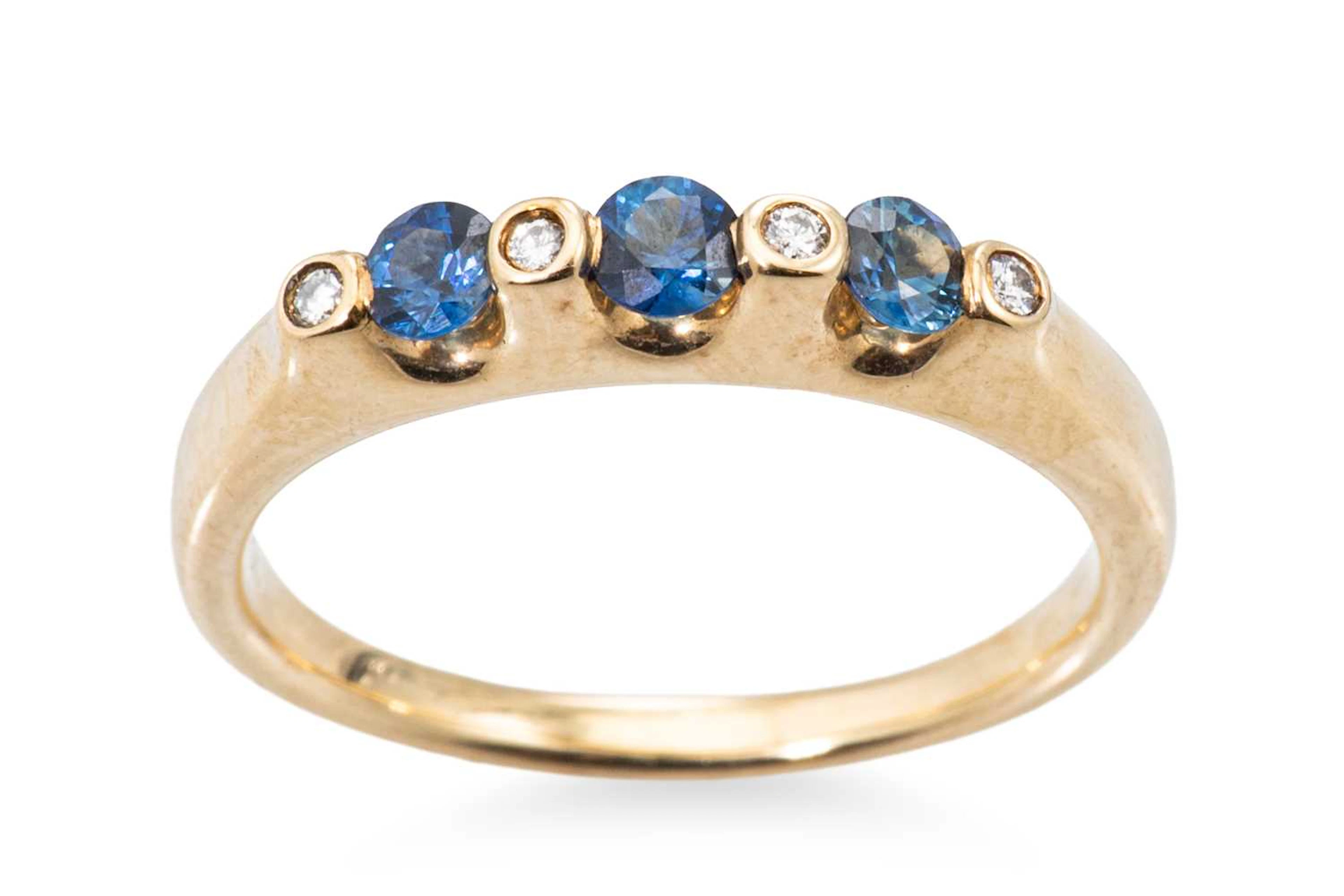 A DIAMOND AND BLUE STONE RING