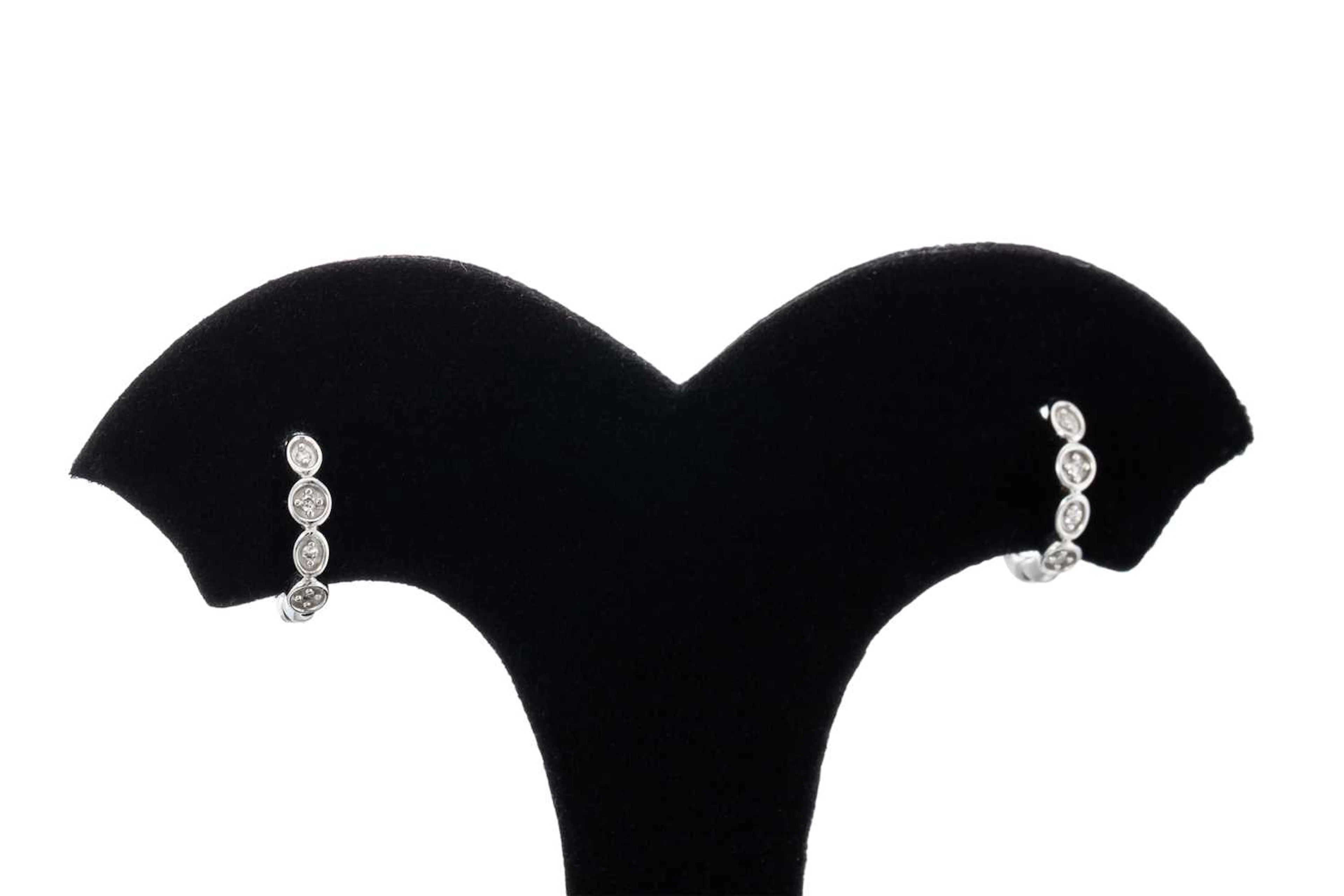 A PAIR OF HUGGIE DIAMOND EARRINGS