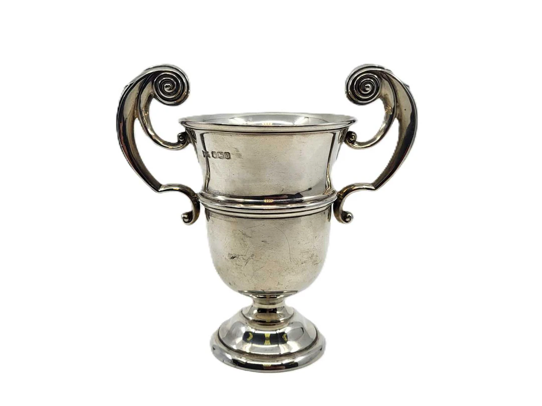 A GEORGE V STERLING SILVER TWO HANDLED TROPHY