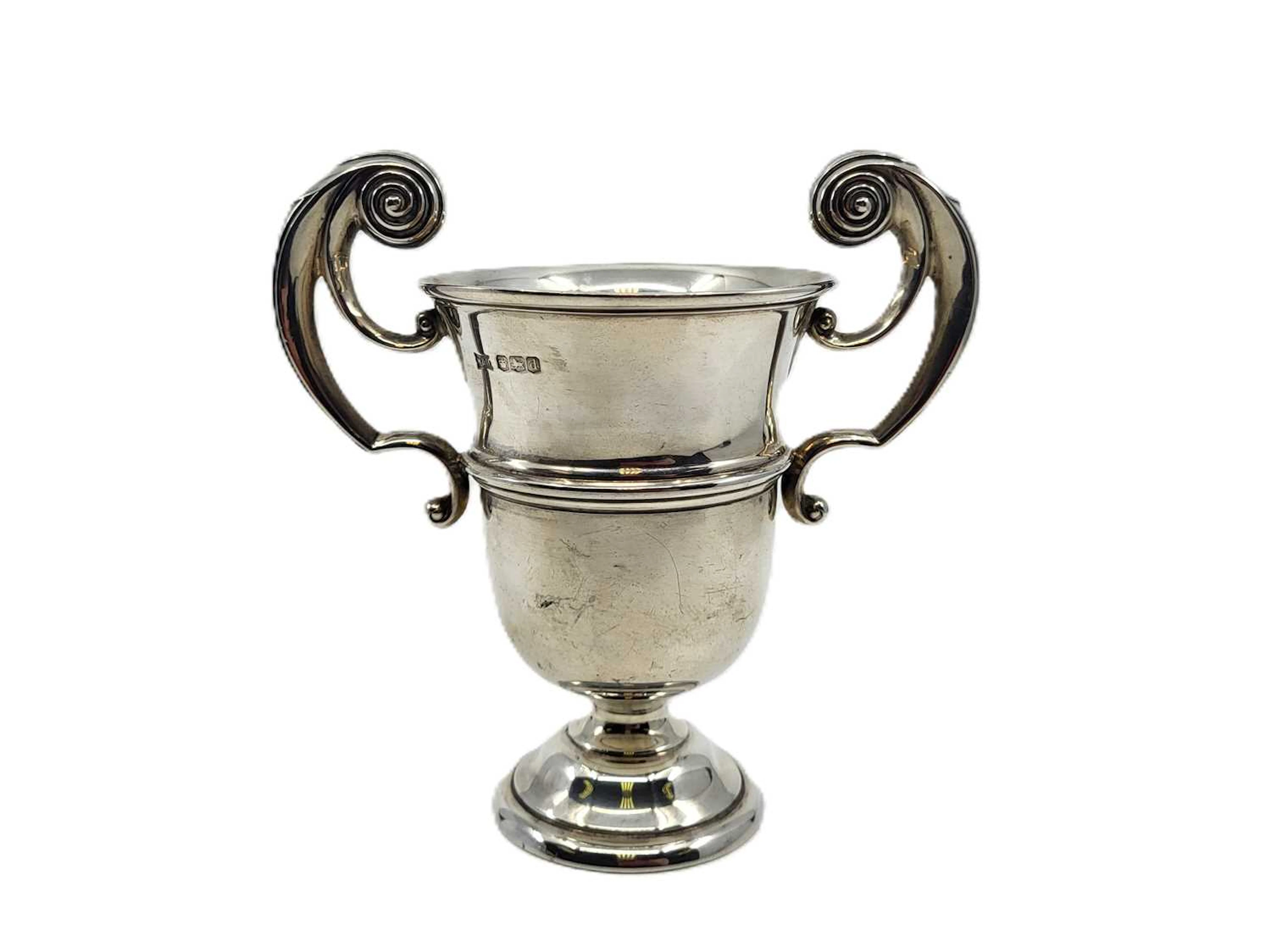 A GEORGE V STERLING SILVER TWO HANDLED TROPHY