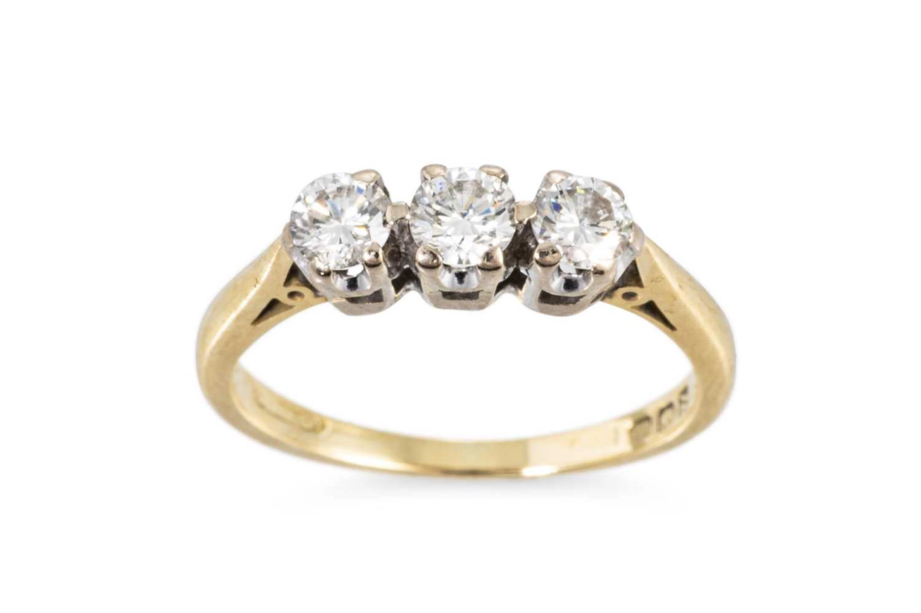 A THREE STONE DIAMOND RING