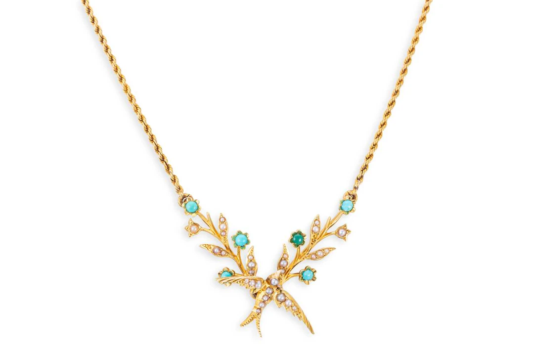 AN EDWARDIAN SEED PEARL AND TURQUOISE SWALLOW NECKLACE