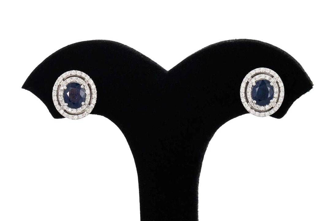 A PAIR OF SAPPHIRE AND DIAMOND CLUSTER EARRINGS