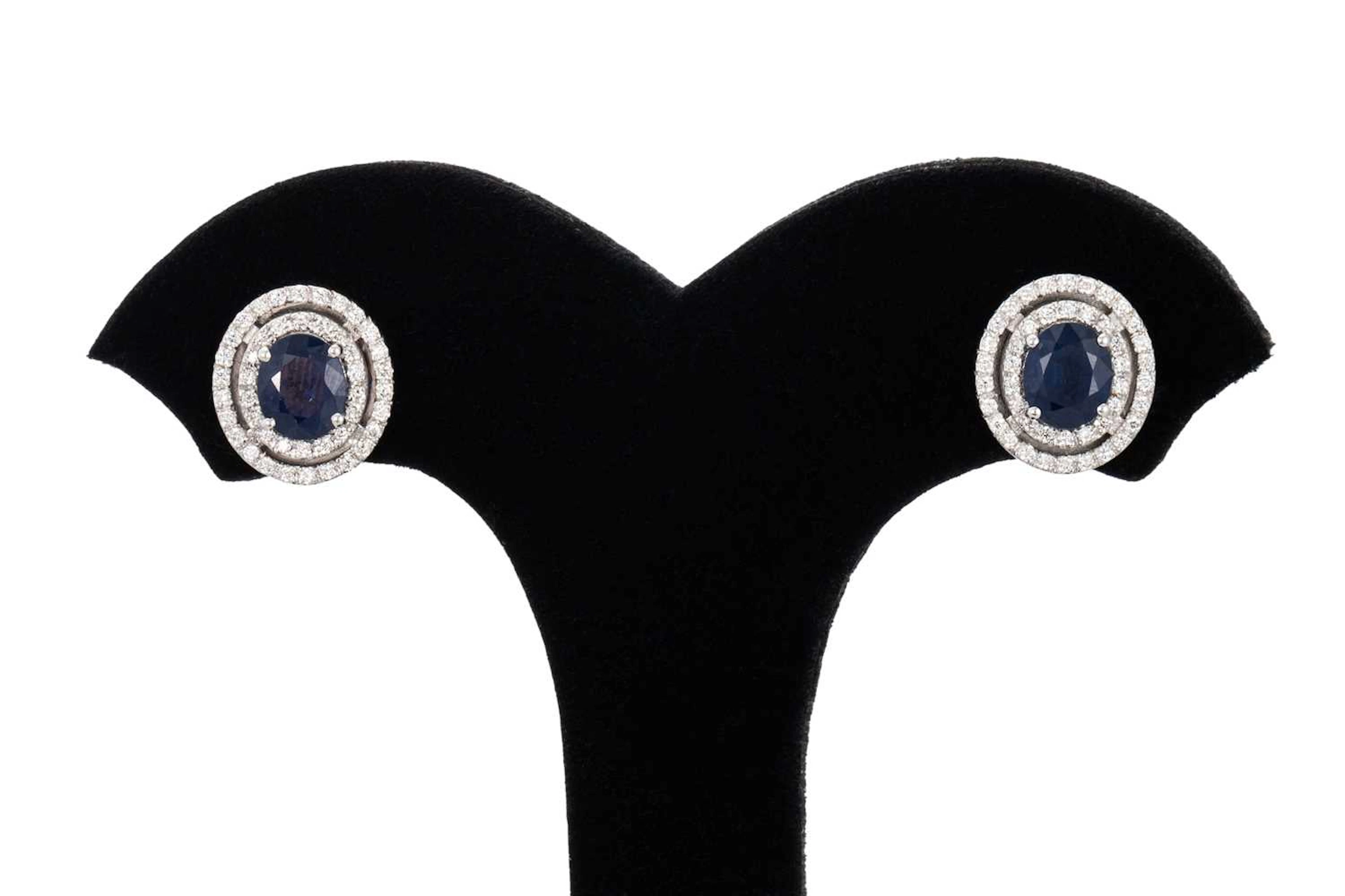 A PAIR OF SAPPHIRE AND DIAMOND CLUSTER EARRINGS