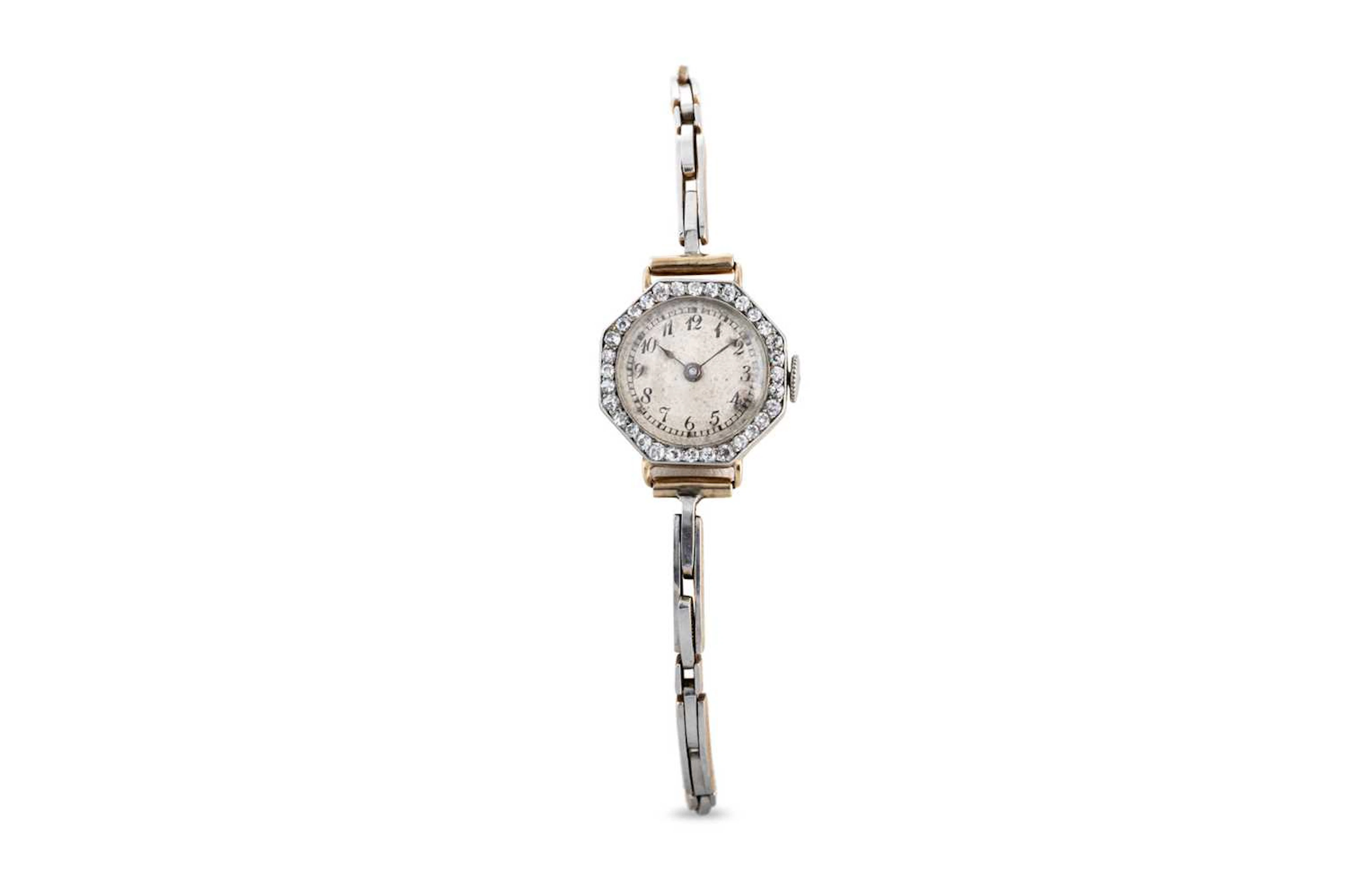 AN ANTIQUE 18CT GOLD AND DIAMOND WRIST WATCH