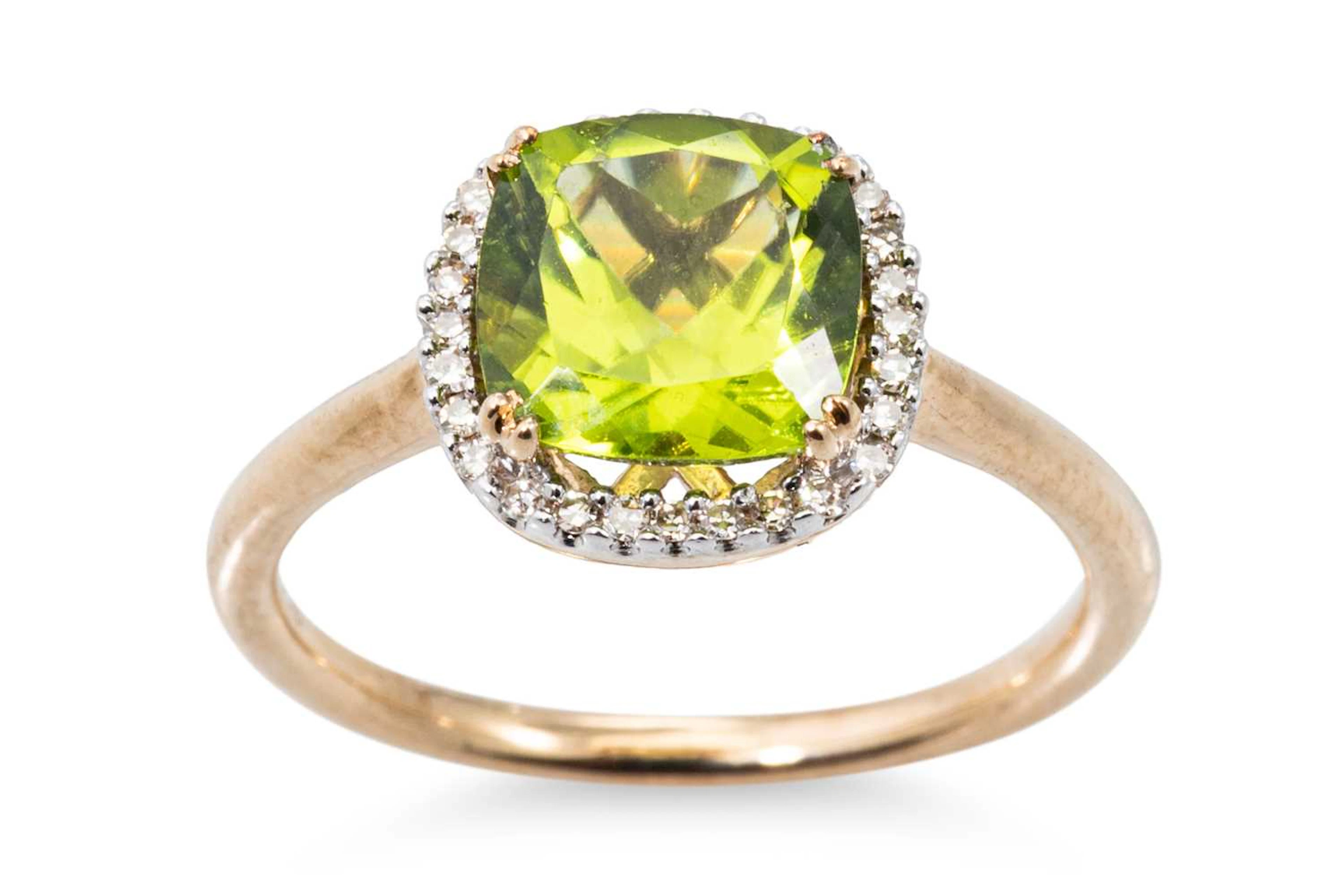 A PERIDOT AND DIAMOND CLUSTER RING