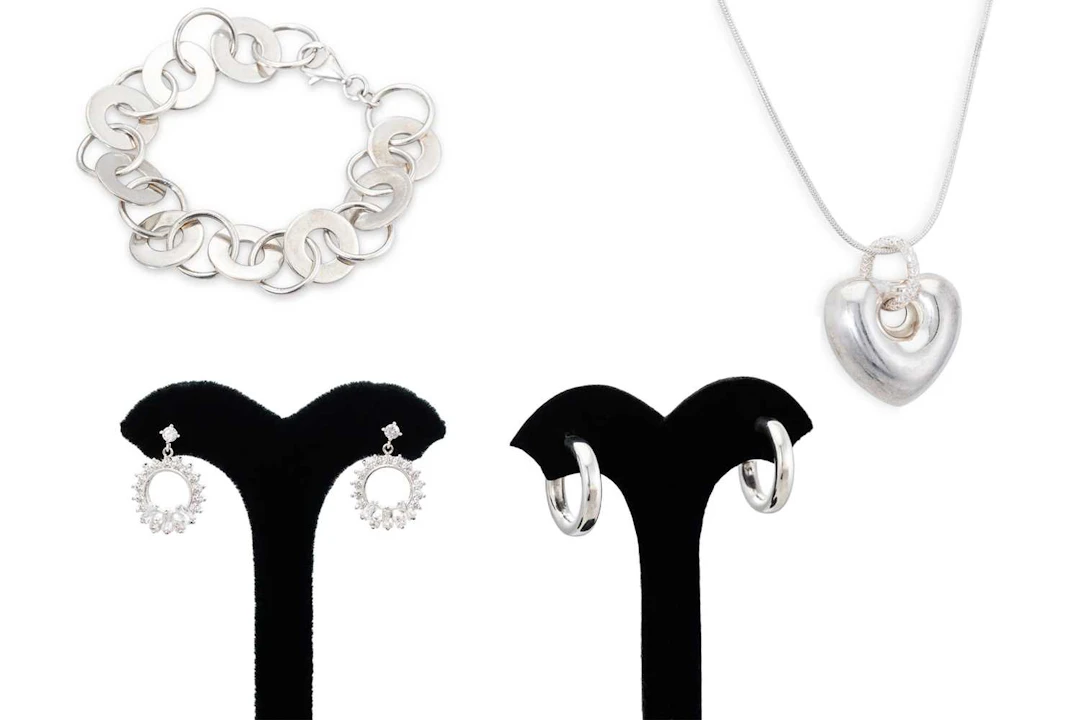 A PAIR OF SILVER HOOP EARRINGS