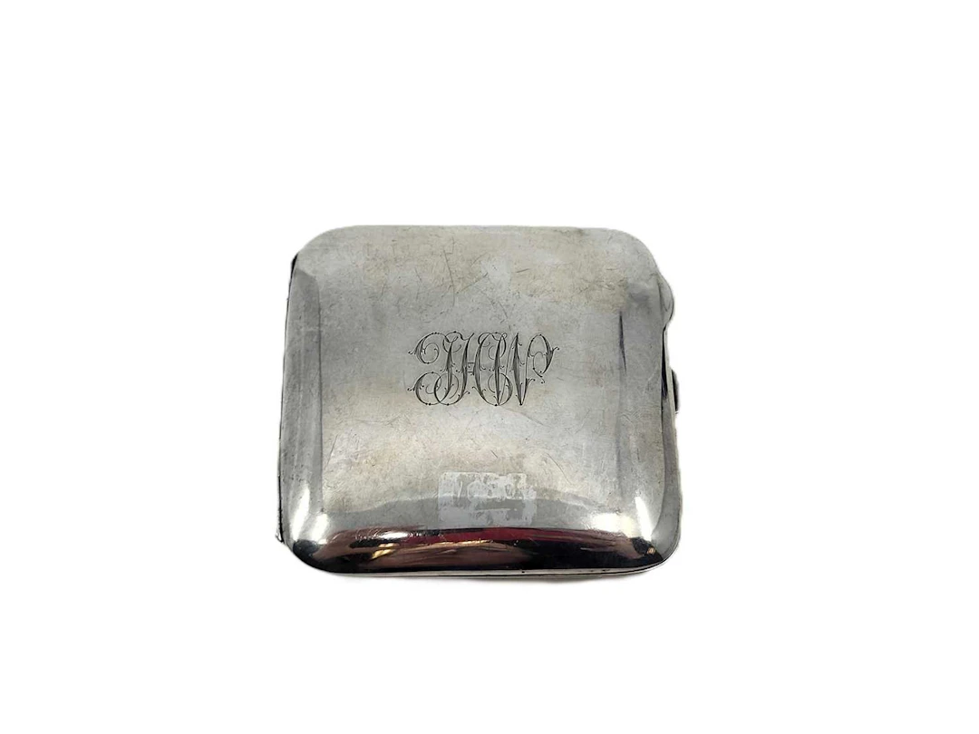A SILVER CIGARETTE CASE