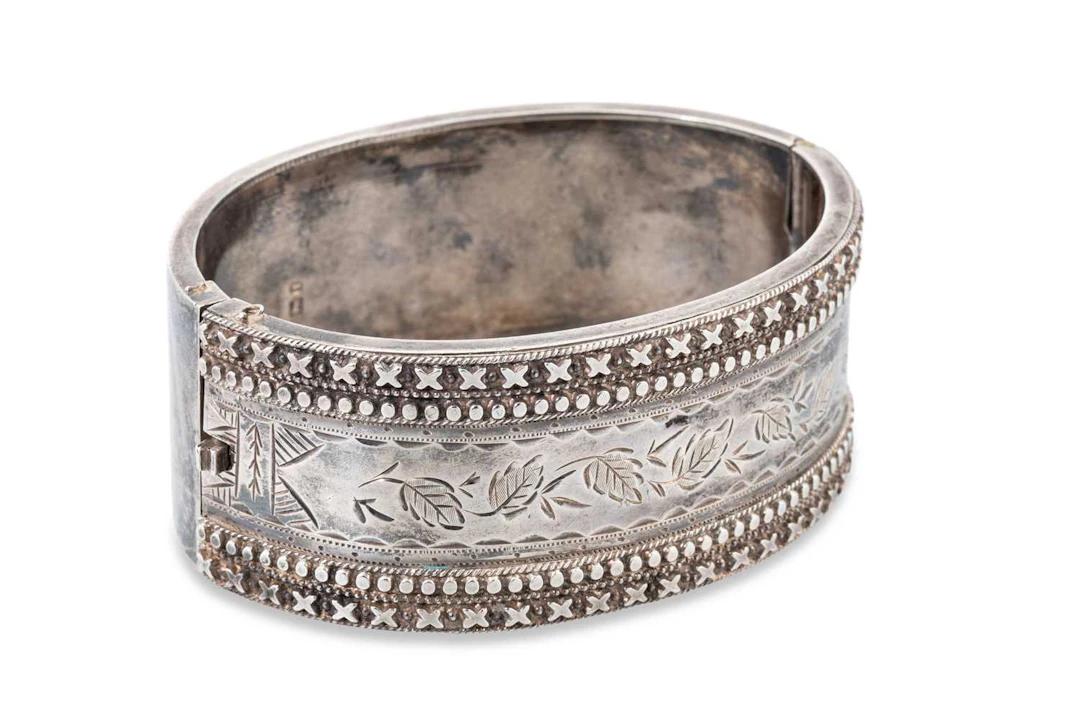 A LATE VICTORIAN SILVER BANGLE