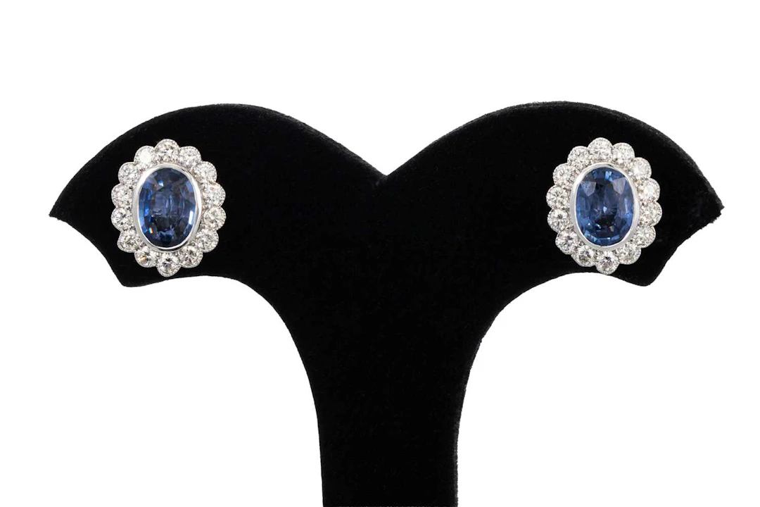 A PAIR OF SAPPHIRE AND DIAMOND CLUSTER EARRINGS