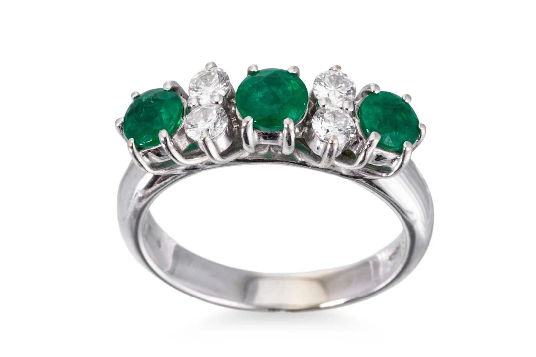 AN EMERALD AND DIAMOND RING