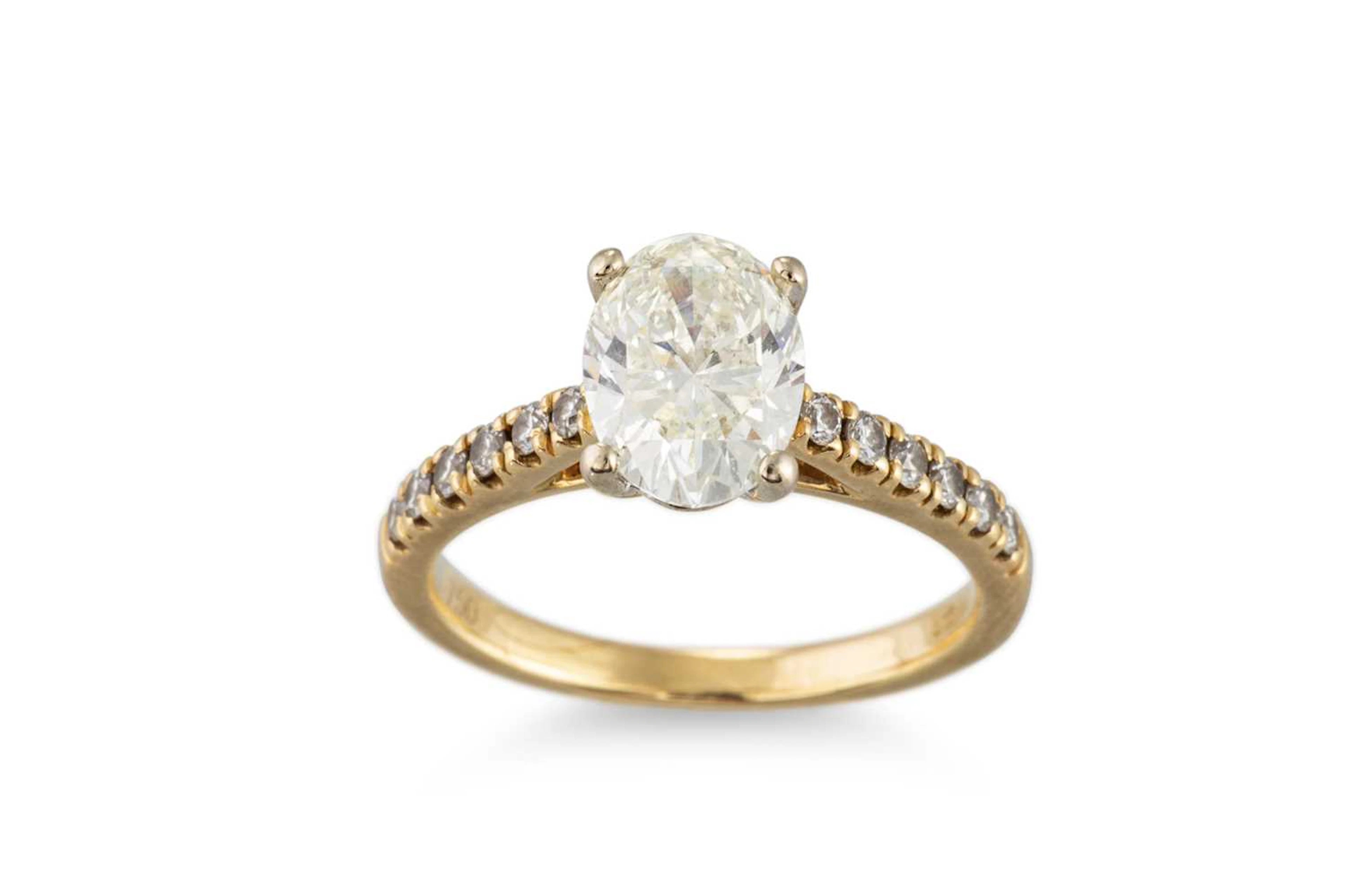 AN OVAL DIAMOND SOLITAIRE RING