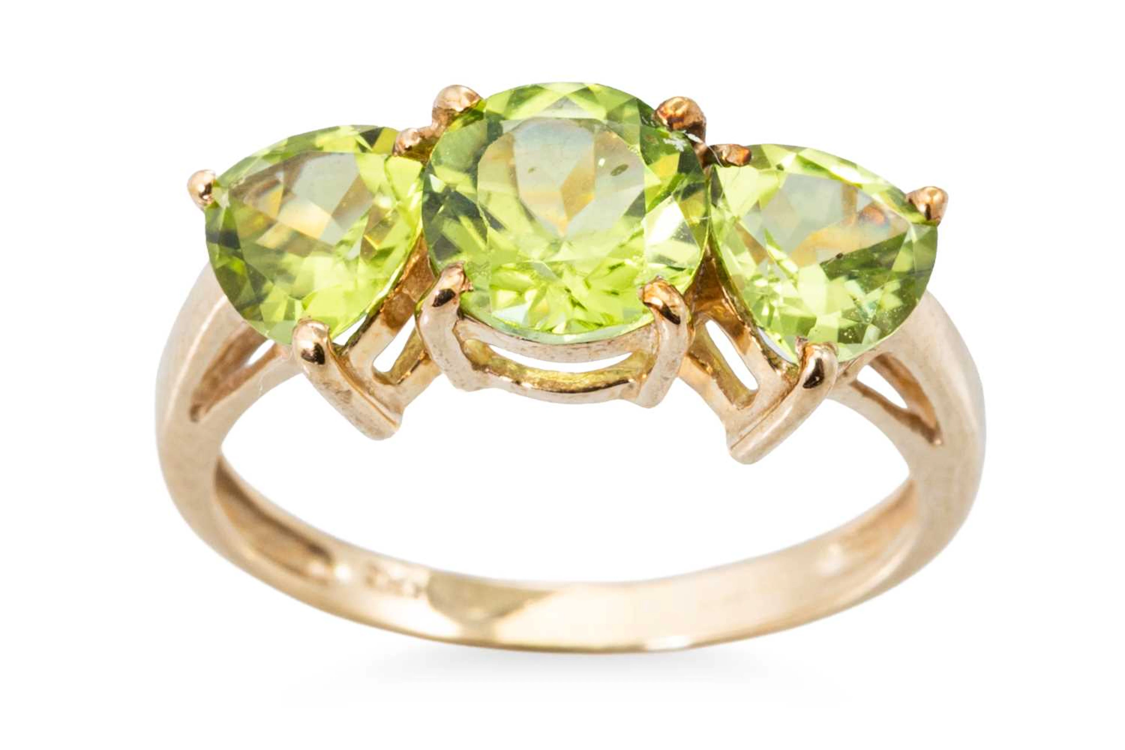 A PERIDOT THREE STONE RING