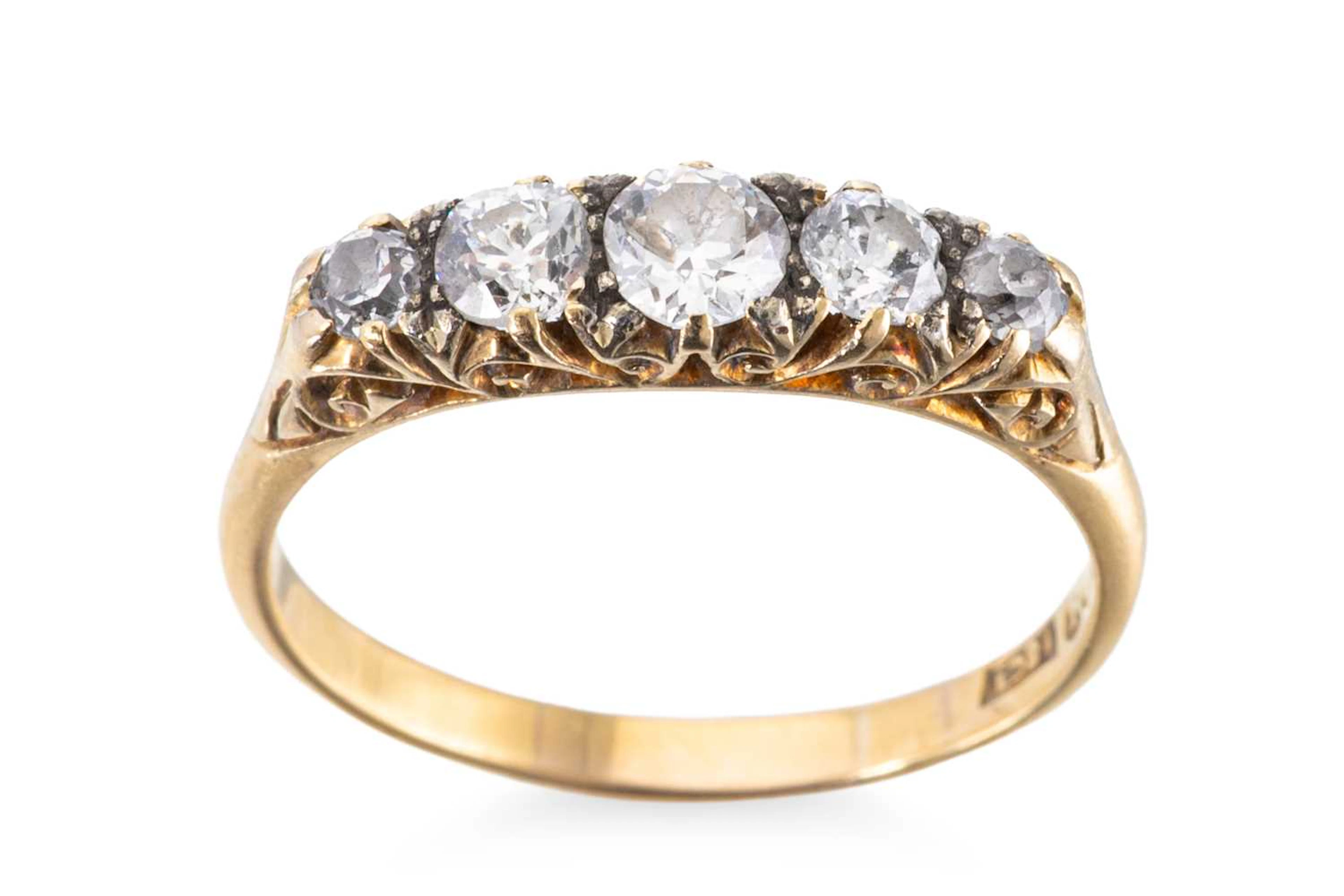 AN ANTIQUE DIAMOND FIVE STONE RING