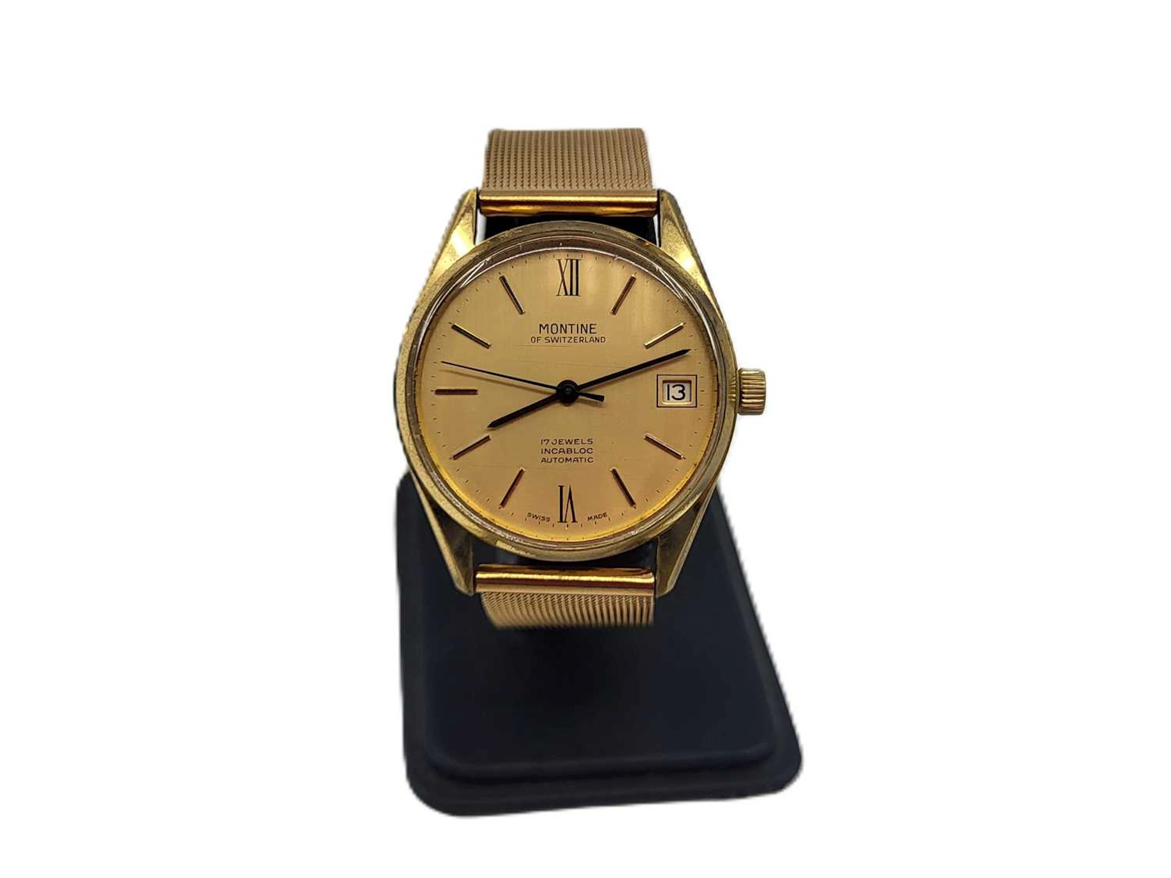 A MONTINE 17 JEWEL AUTOMATIC WRIST WATCH