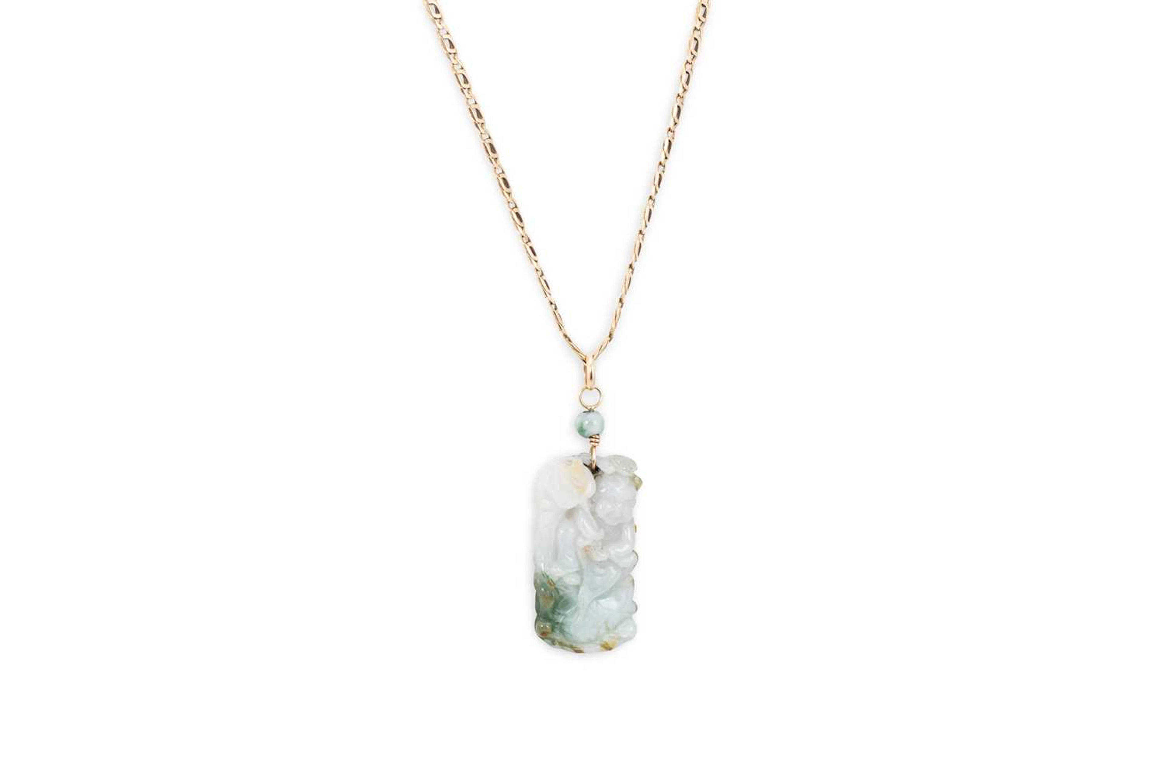 A CARVED JADE PENDANT