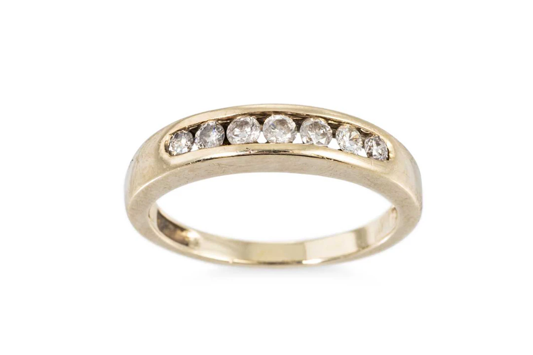 A DIAMOND HALF HOOP ETERNITY RING
