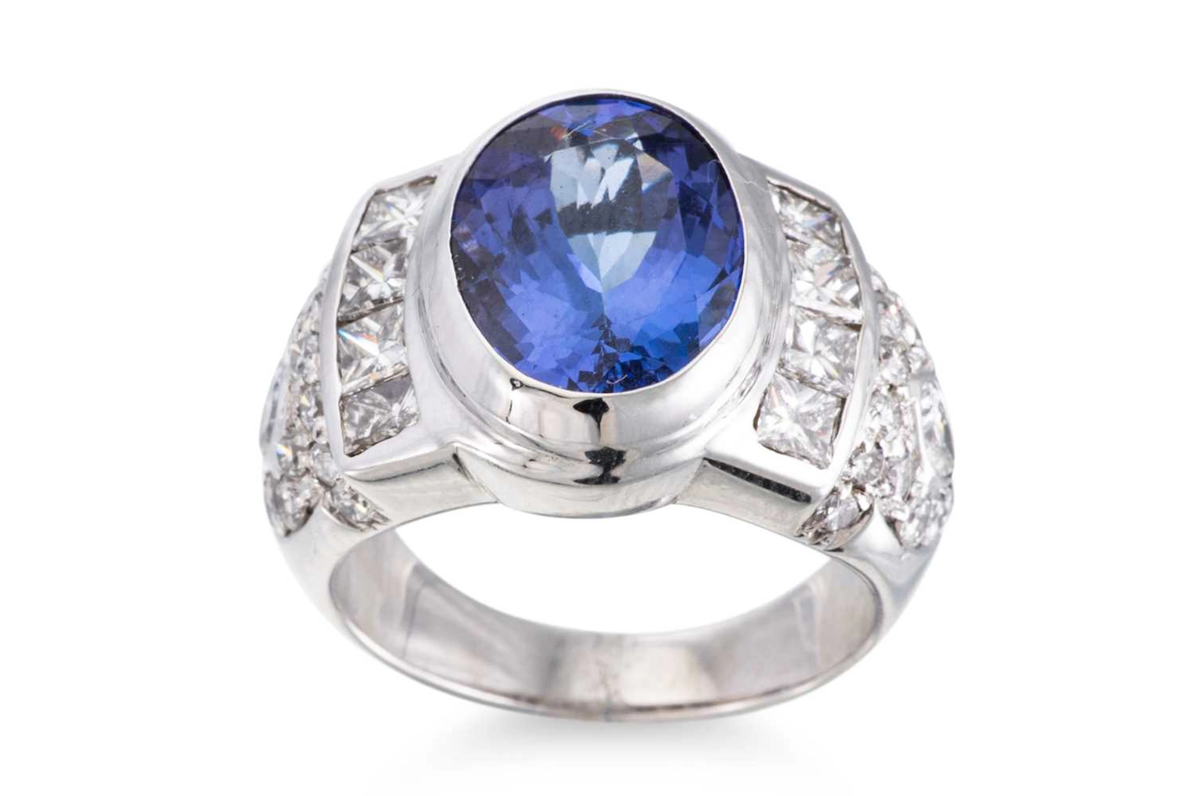 A TANZANITE AND DIAMOND RING