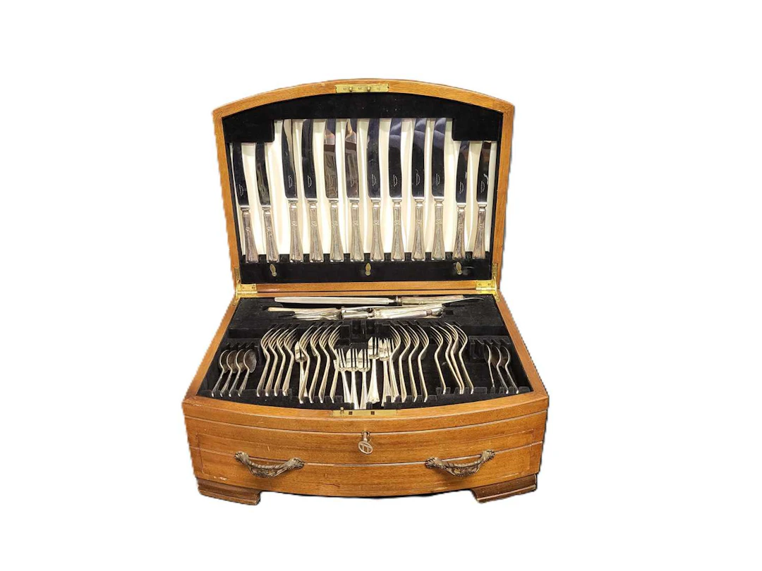 A PRE-WAR WALNUT VENEERED CASED CANTEEN OF EPNS CUTLERY