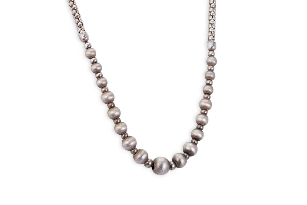 A SILVER BEADED NECKLACE