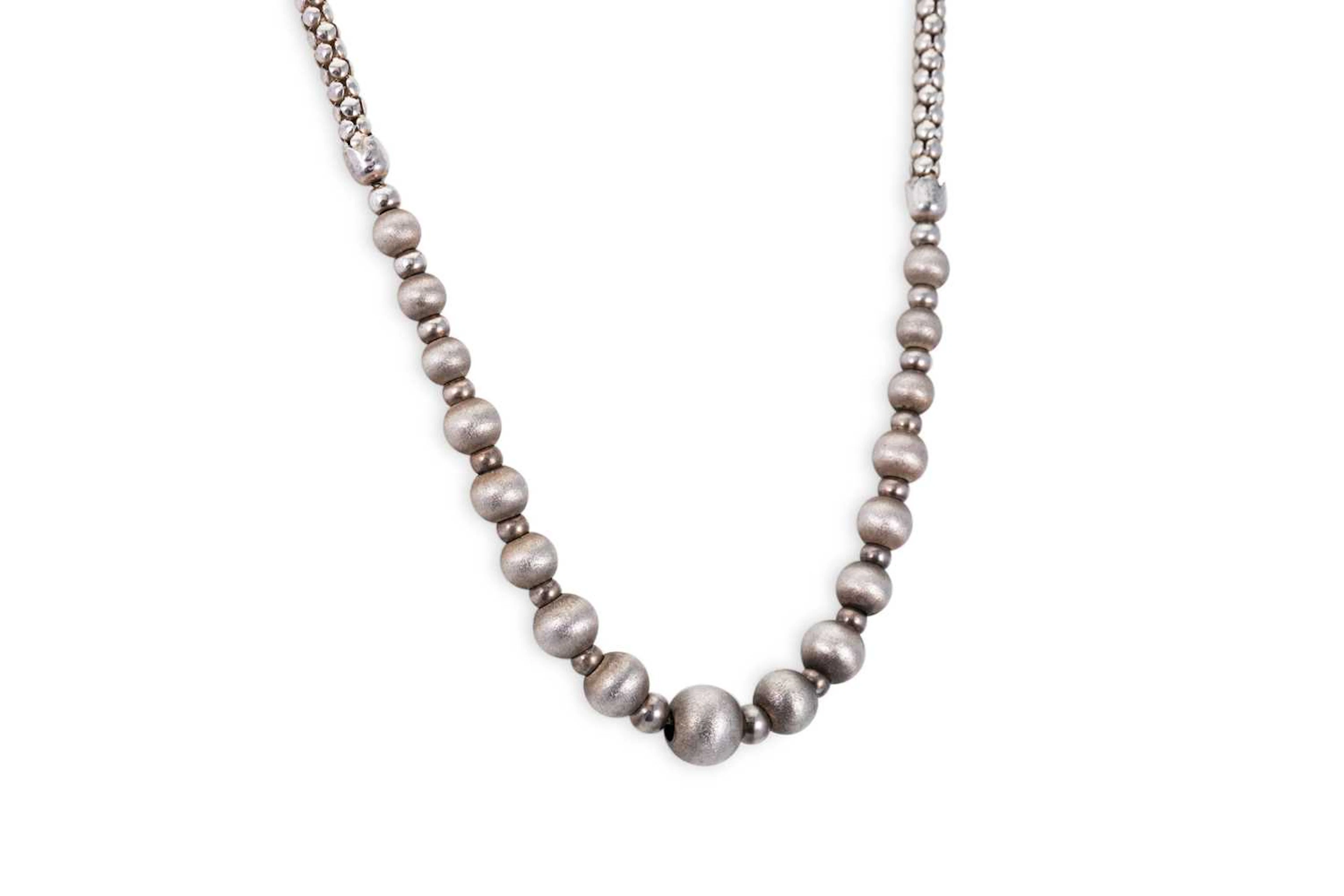 A SILVER BEADED NECKLACE