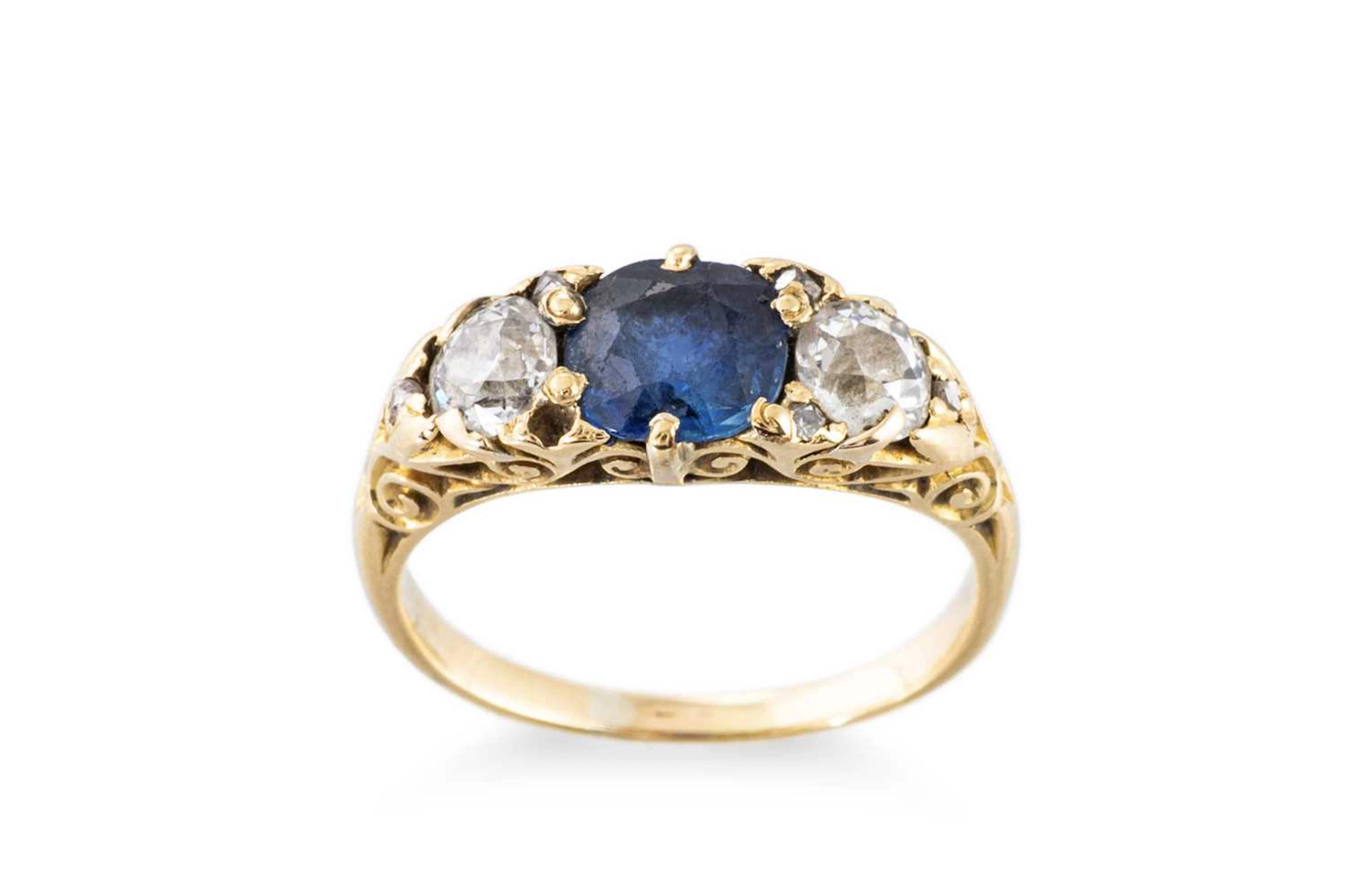 A VERY LATE VICTORIAN DIAMOND AND SAPPHIRE THREE STONE RING