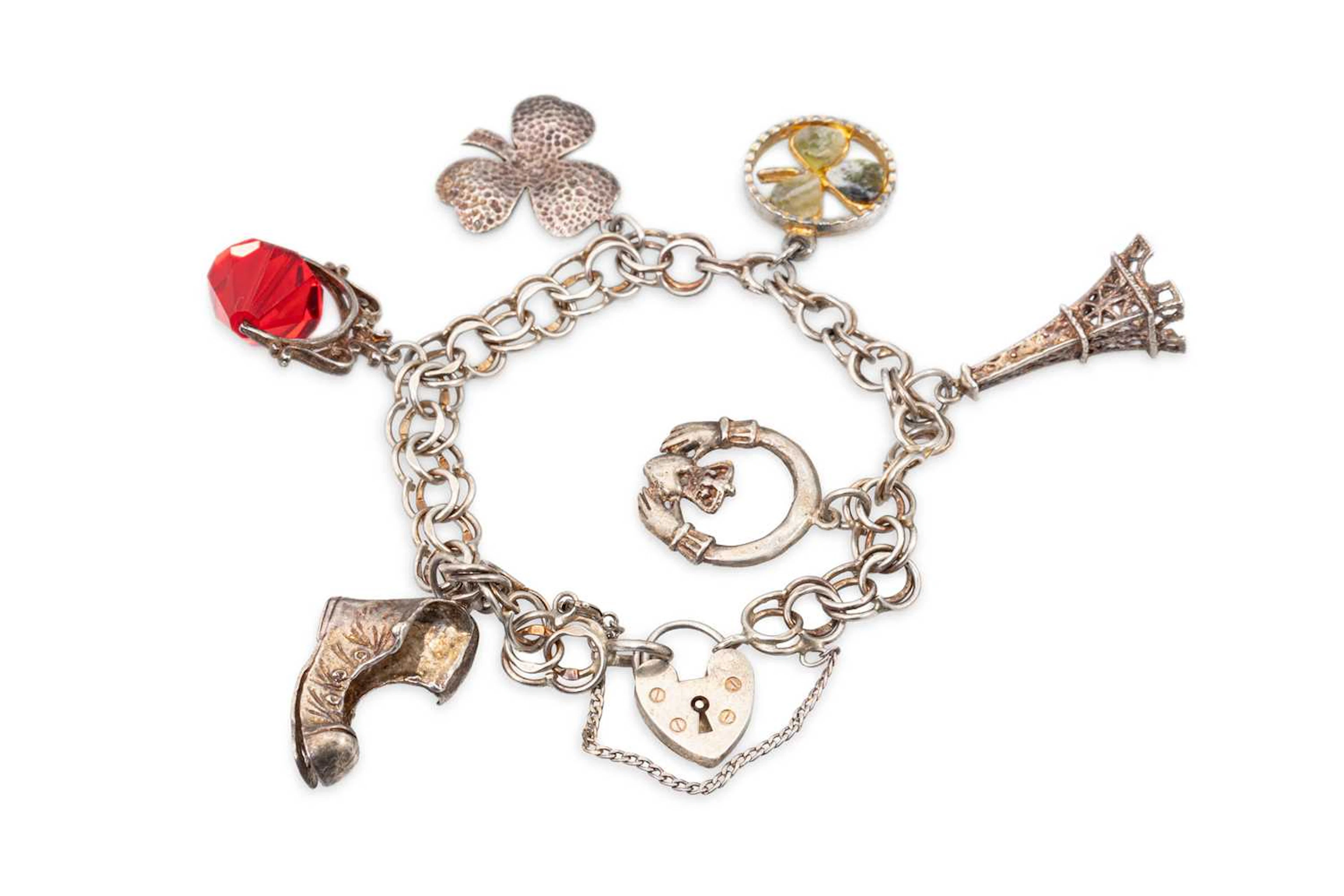 A STERLING SILVER CHARM BRACELET