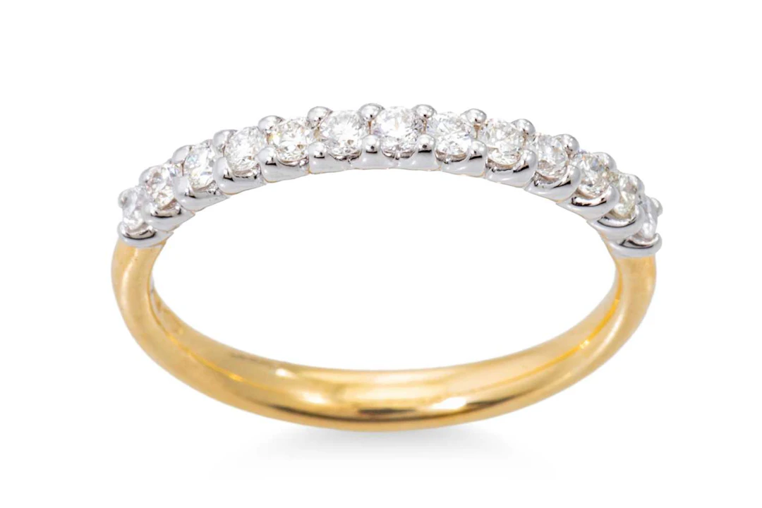 A DIAMOND SET HALF ETERNITY RING