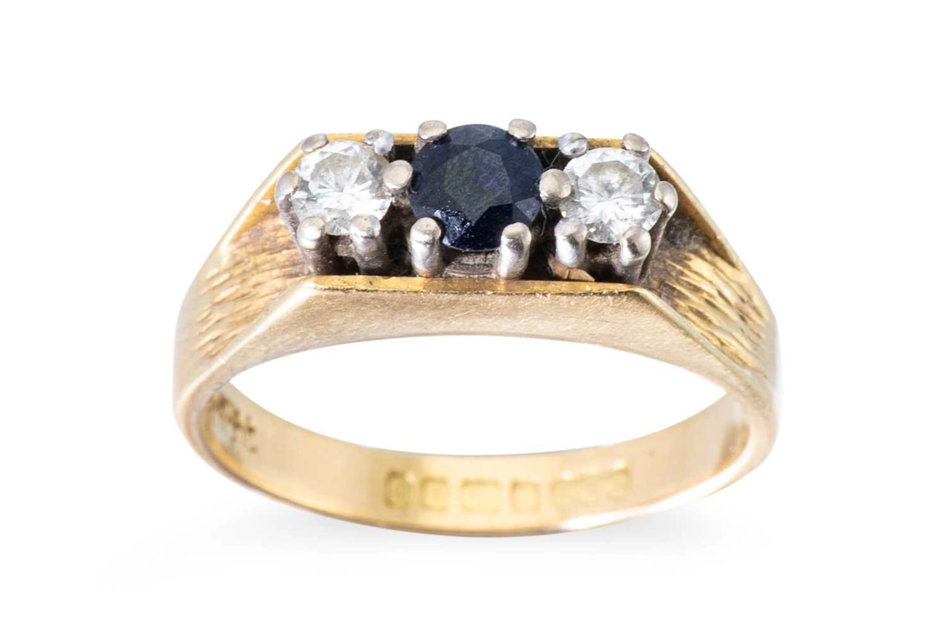 A SAPPHIRE AND DIAMOND THREE STONE RING