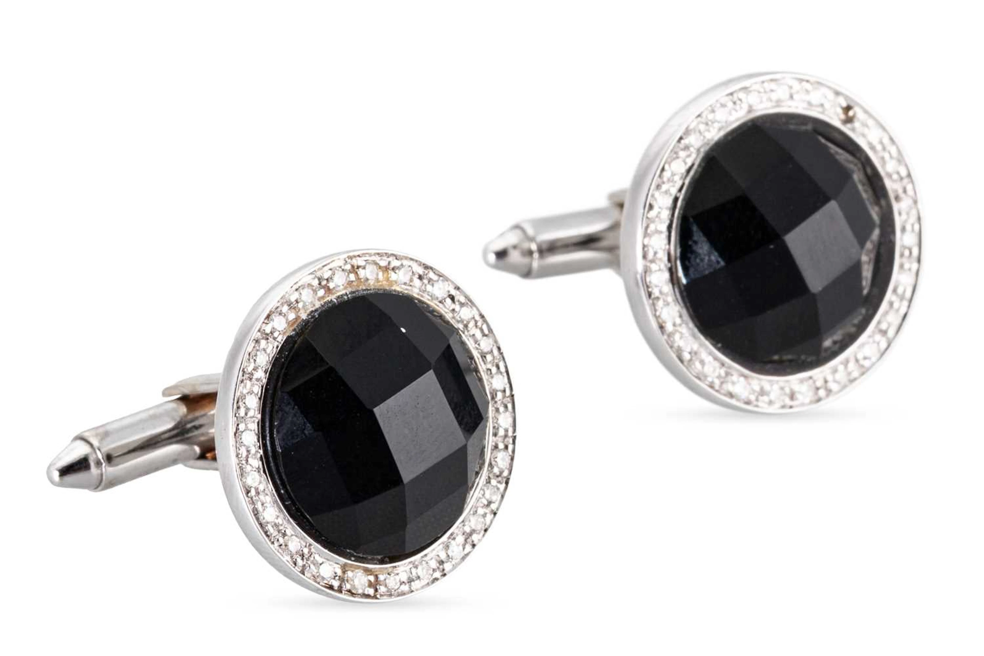 A PAIR OF ONYX AND DIAMOND SET CUFFLINKS