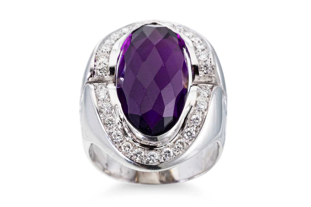AN AMETHYST AND DIAMOND CLUSTER RING