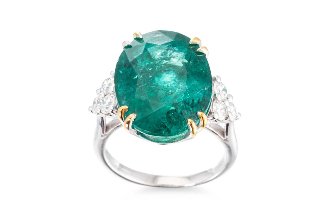 AN EMERALD AND DIAMOND RING