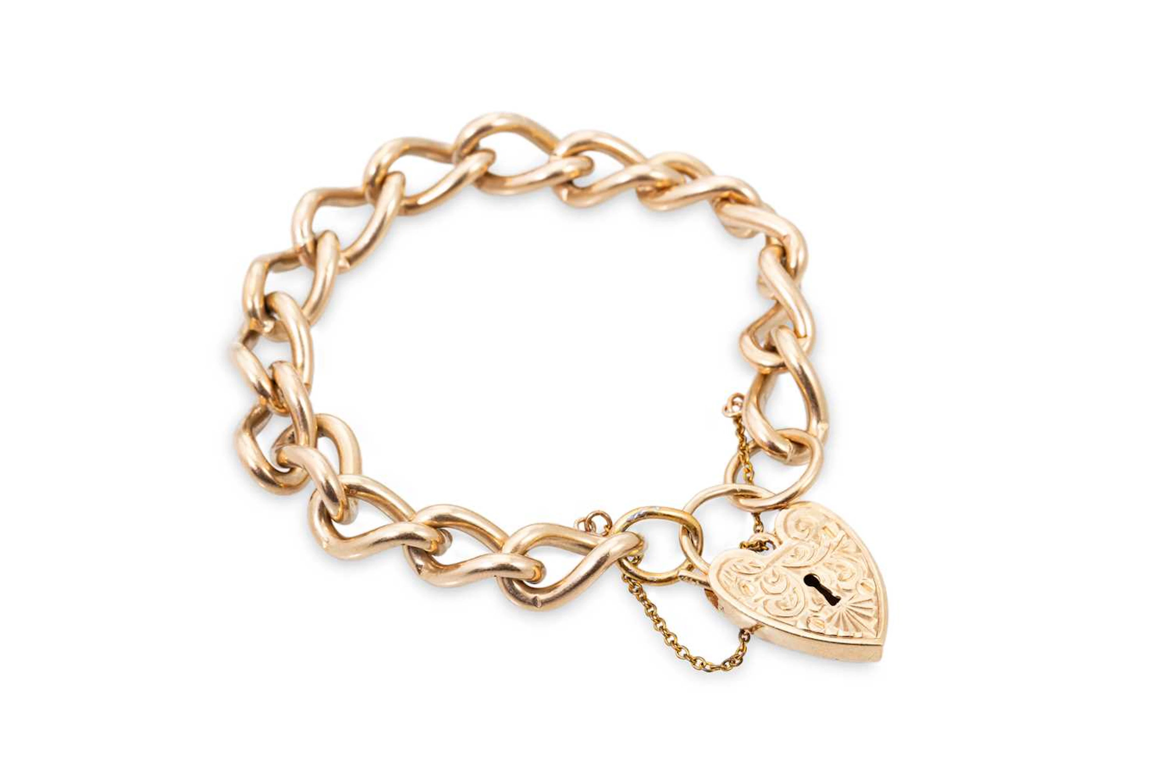AN ANTIQUE 9CT GOLD CURB LINK BRACELET