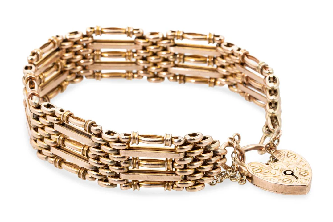 AN ANTIQUE 9CT GOLD GATE BRACELET