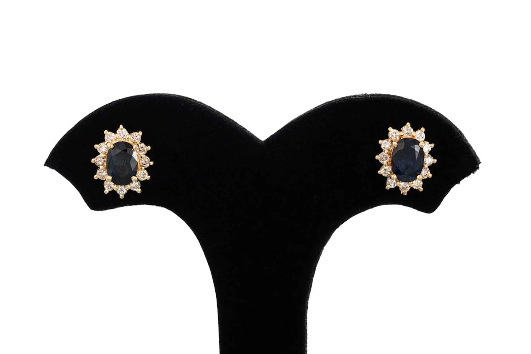 A PAIR OF DIAMOND AND SAPPHIRE CLUSTER EARRINGS