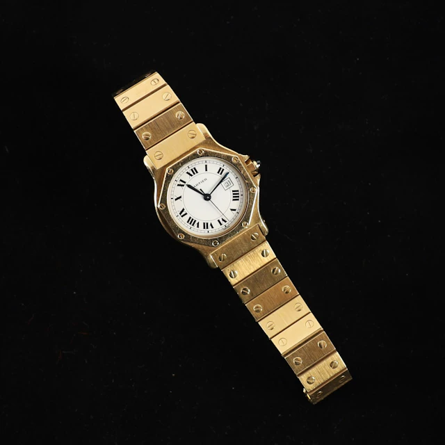 BEAUTIFUL "SANTOS OCTOGONALE" MEN'S WATCH BY CARTIER IN GOLD - Lot 95
