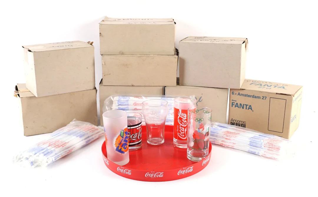 SET OF 46 COCA-COLA, ORANGINA, FANTA, AND OTHER GLASSES. - Lot 185